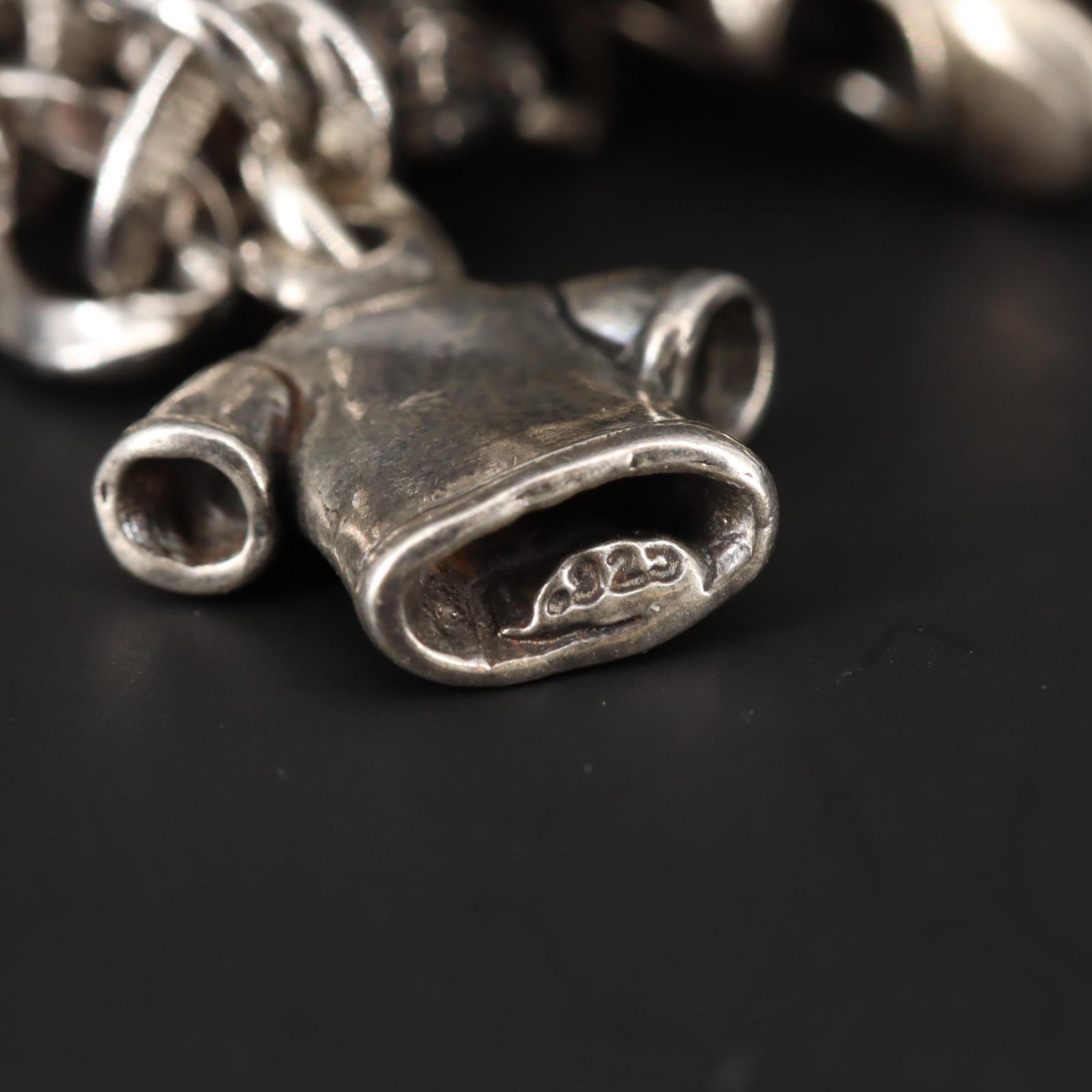 Charm Bracelet With Sterling Silver Charms Including Fairy and Circus Cart