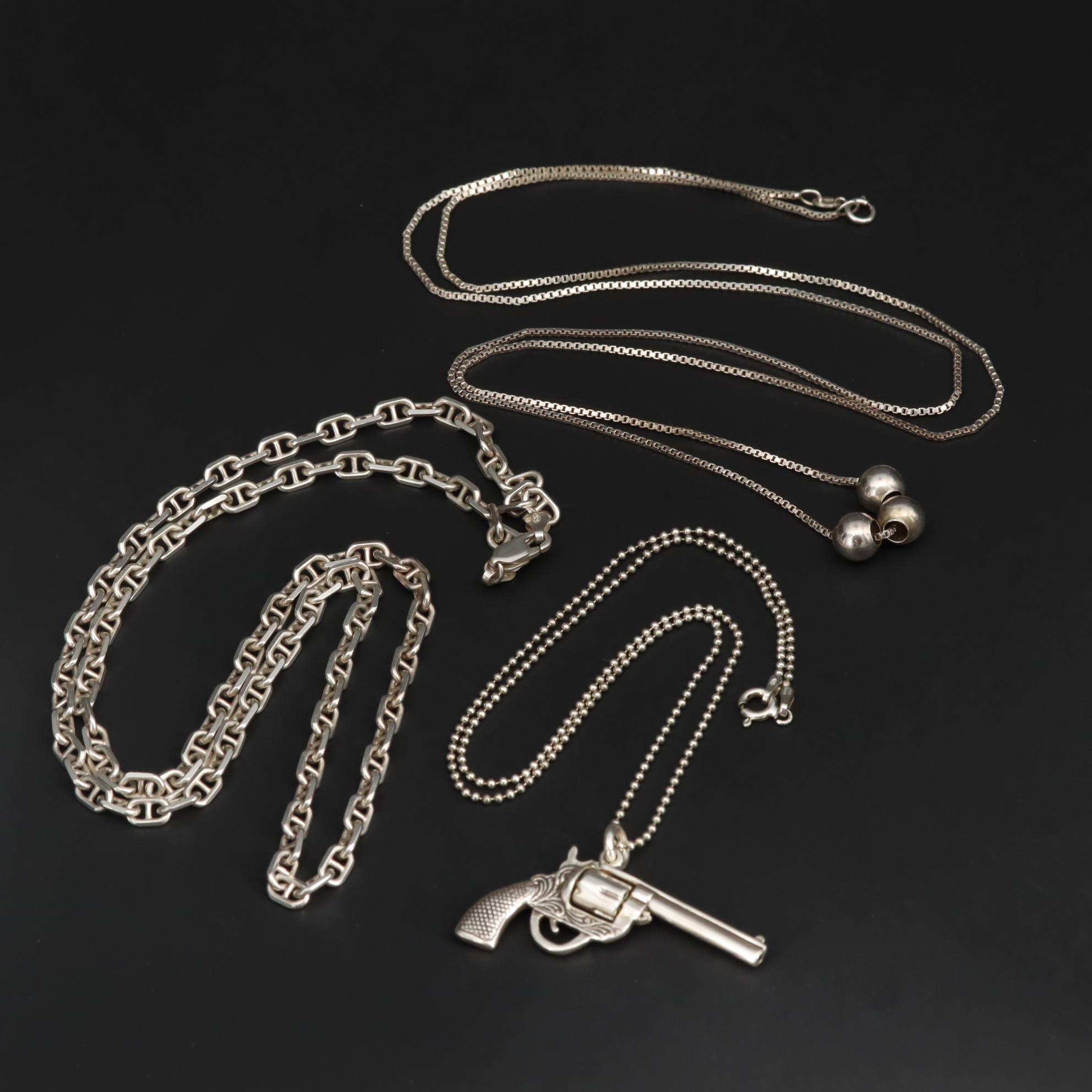 Sterling Silver Necklaces Including Cable Chain and Articulated Revolver Pendant