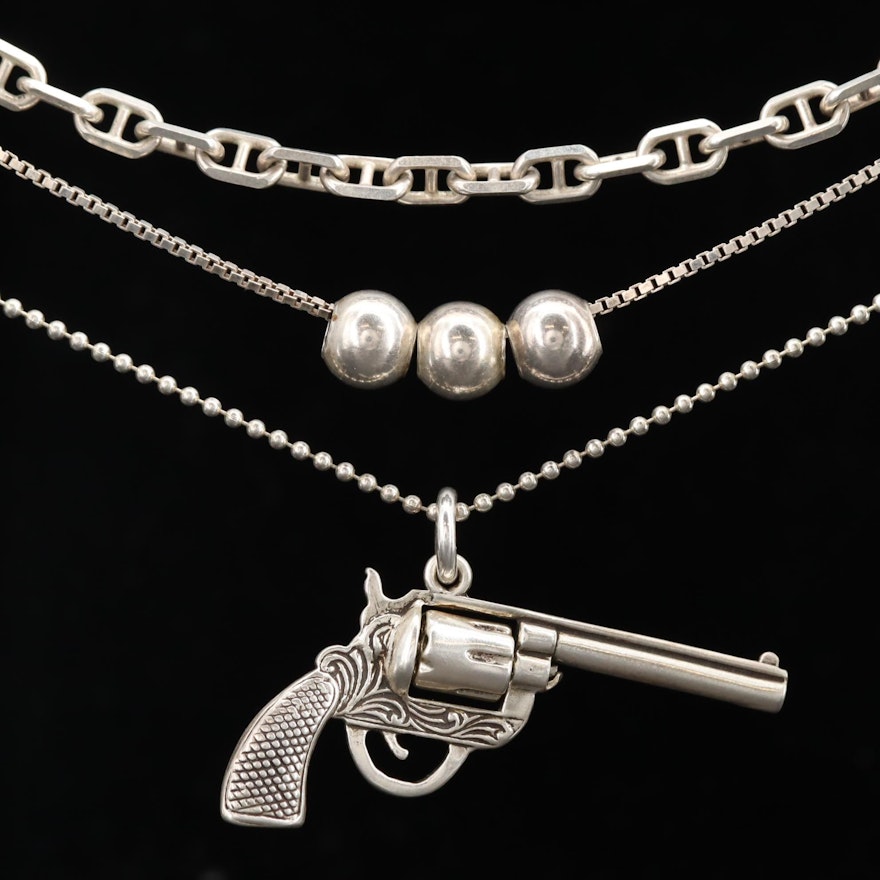 Sterling Silver Necklaces Including Cable Chain and Articulated Revolver Pendant