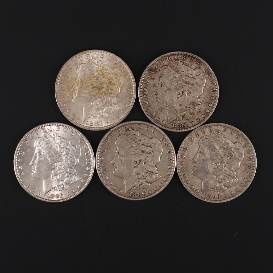 Five Silver Morgan Dollars Including 1883-O, 1884, 1885, 1886, and 1890-O