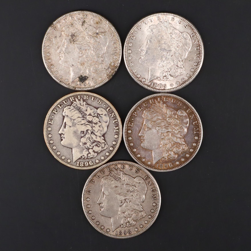 Five Silver Morgan Dollars Including 1884, 1885, 1896, 1896-O, and 1898-O