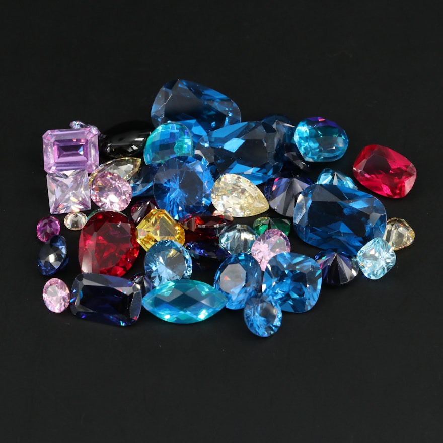 Loose Gemstone Assortment Including Sapphires and Rubies