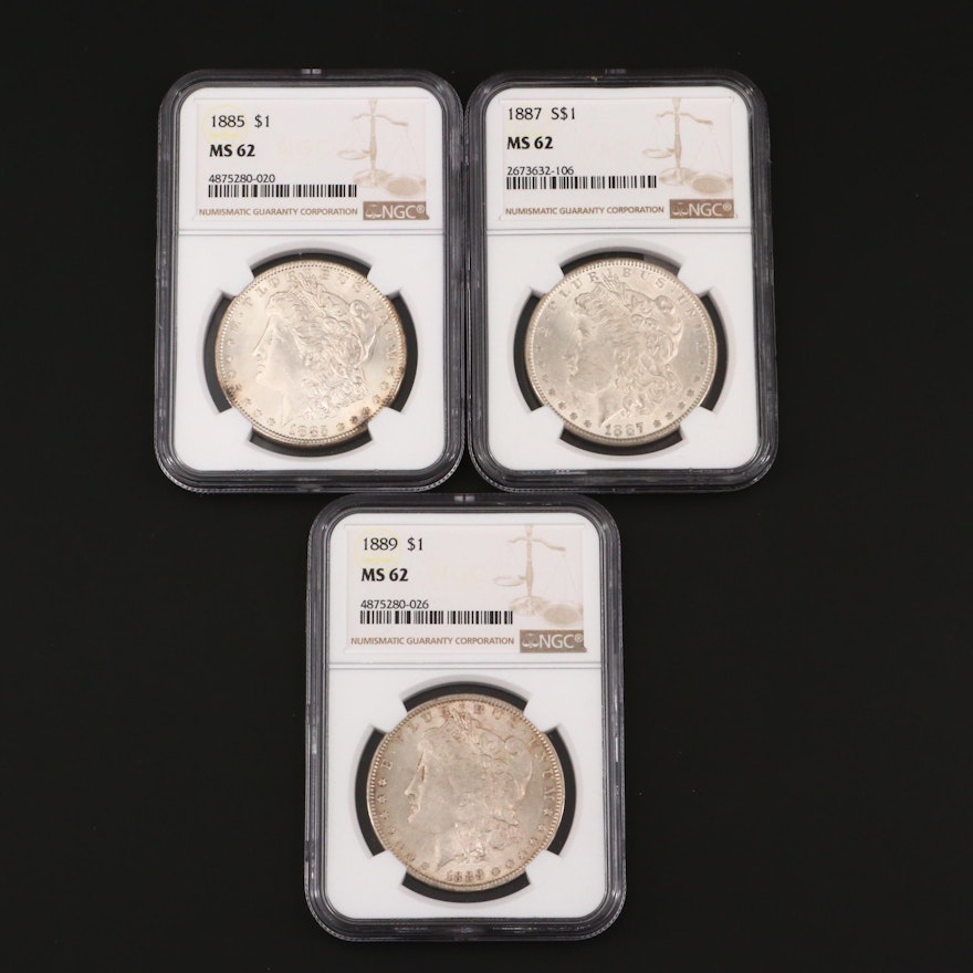 Three NGC Graded MS62 Silver Morgan Dollars Including an 1885, 1887, and 1889