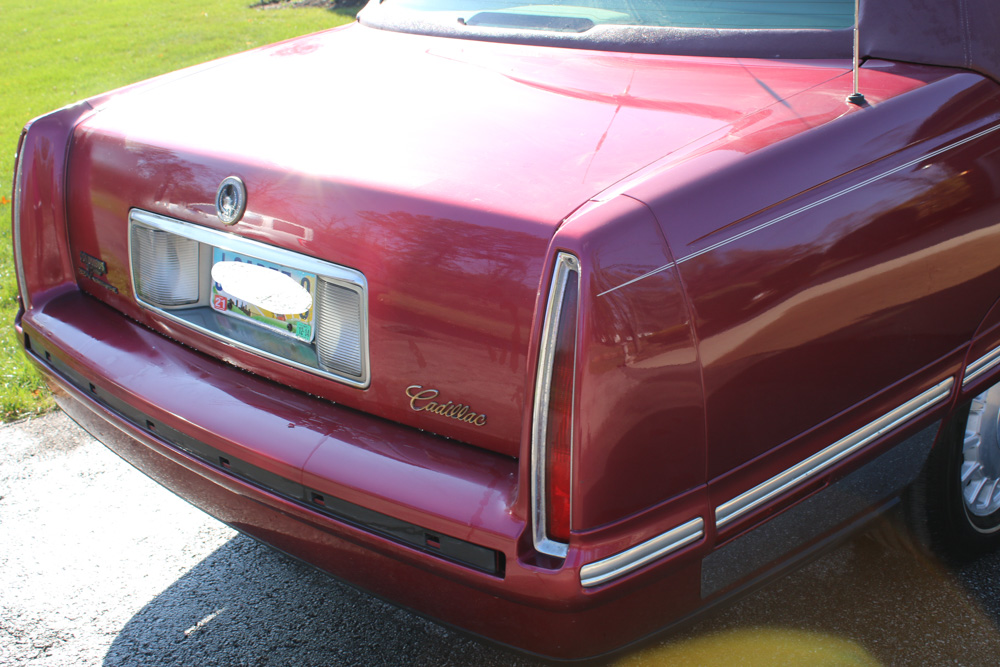 1999 Cadillac DeVille Tuxedo Edition Sedan in Crimson Pearl