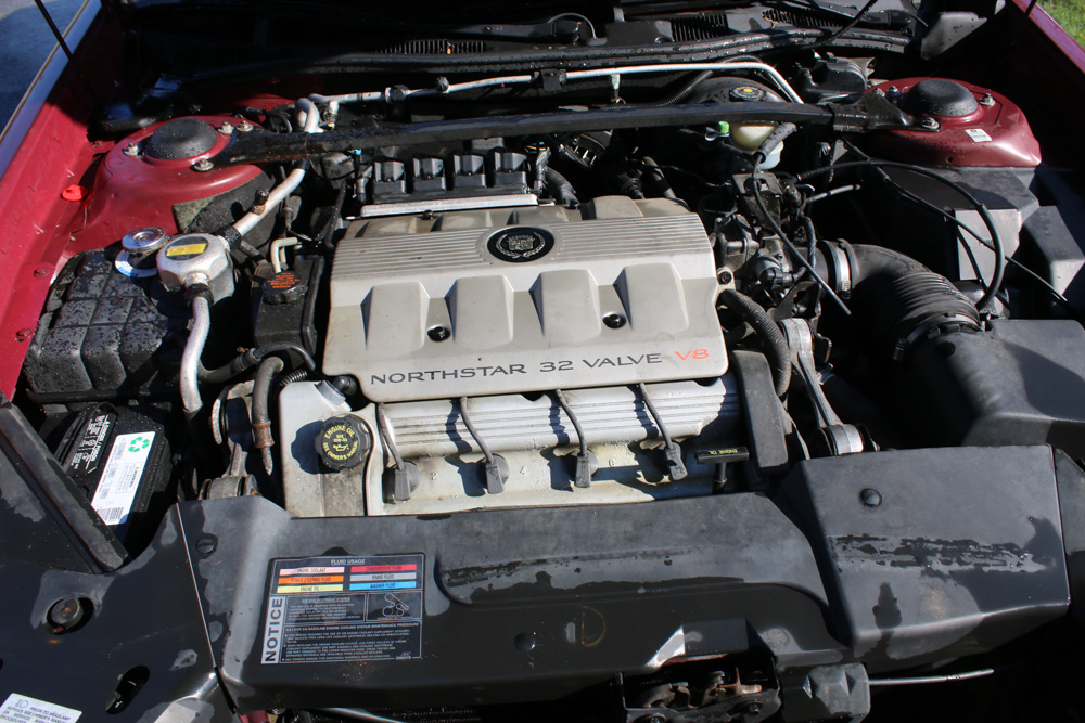 1999 Cadillac DeVille Tuxedo Edition Sedan in Crimson Pearl