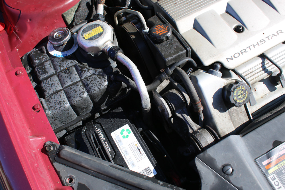 1999 Cadillac DeVille Tuxedo Edition Sedan in Crimson Pearl