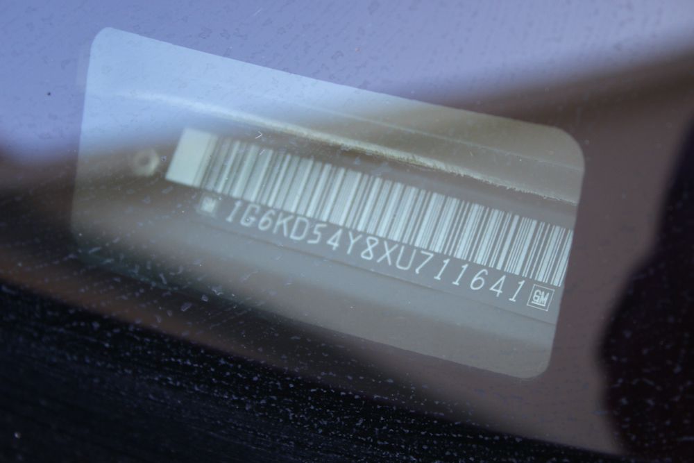 1999 Cadillac DeVille Tuxedo Edition Sedan in Crimson Pearl