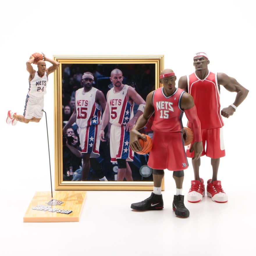 LeBron, Jefferson, and Carter Statues with a Framed Picture