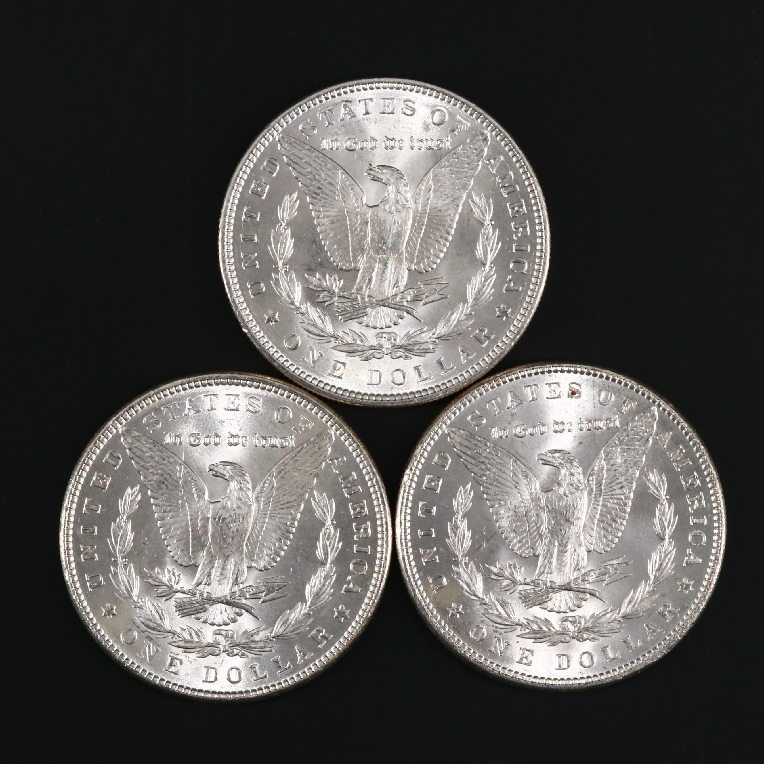 Eight Uncirculated Morgan Silver Dollars