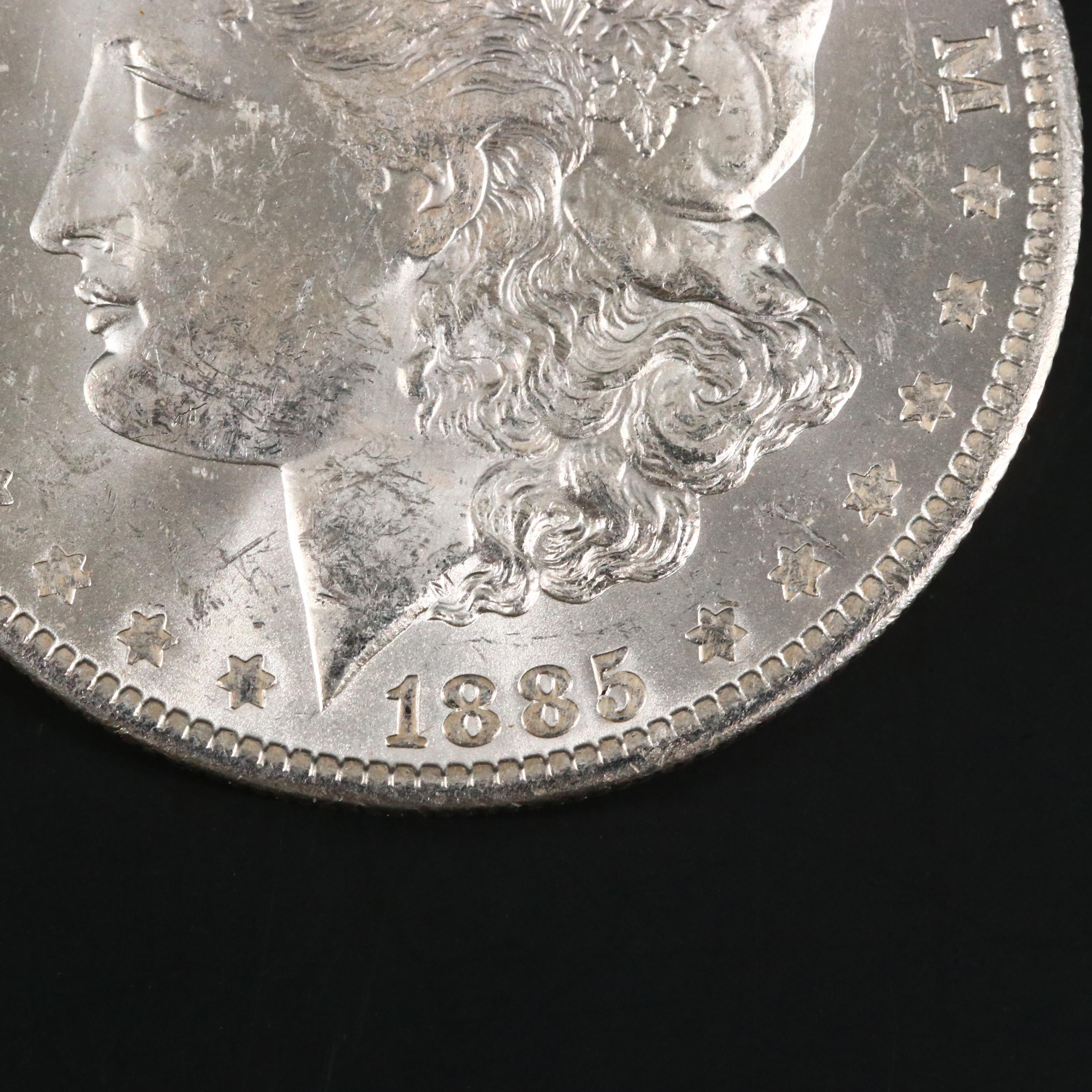 Eight Uncirculated Morgan Silver Dollars