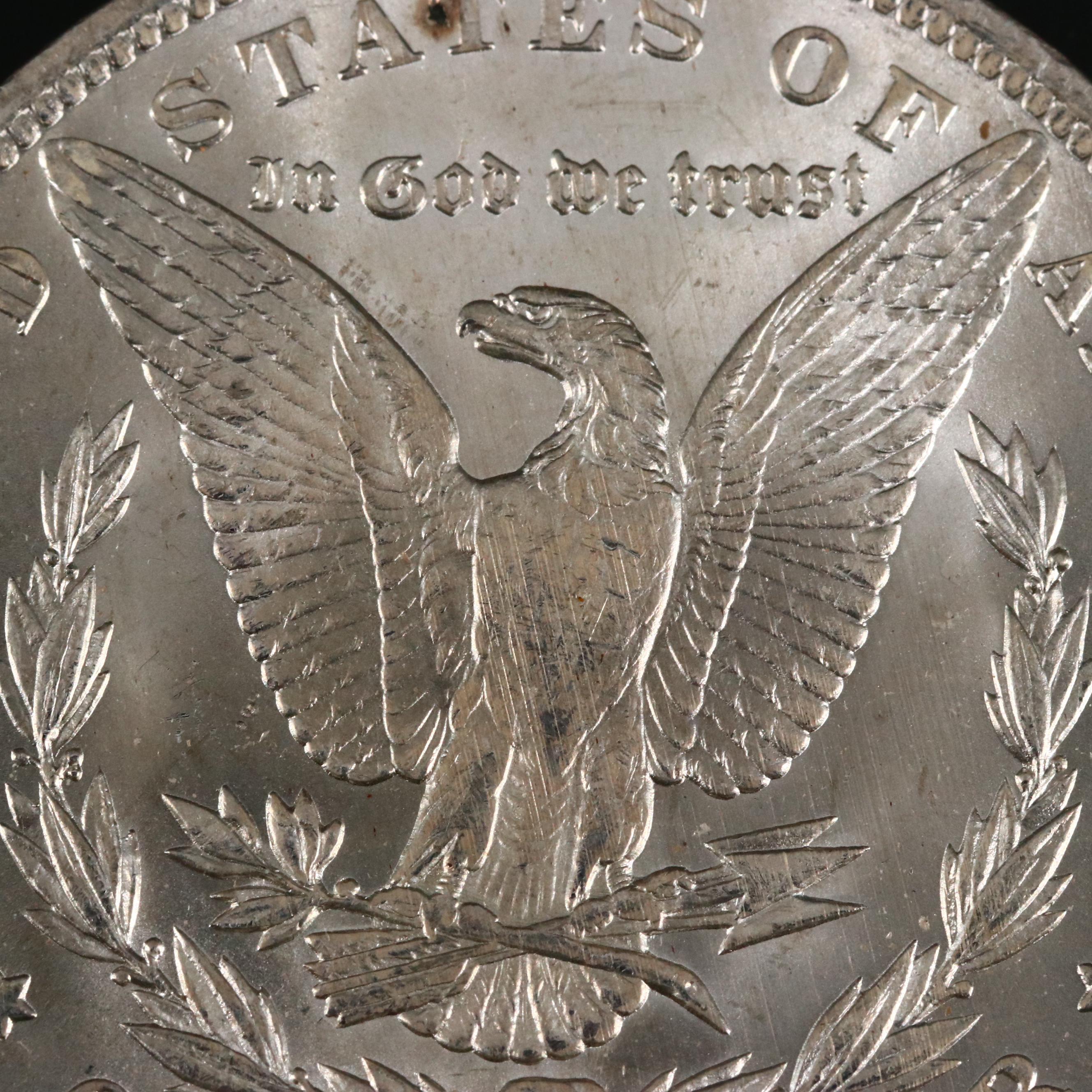 Eight Uncirculated Morgan Silver Dollars