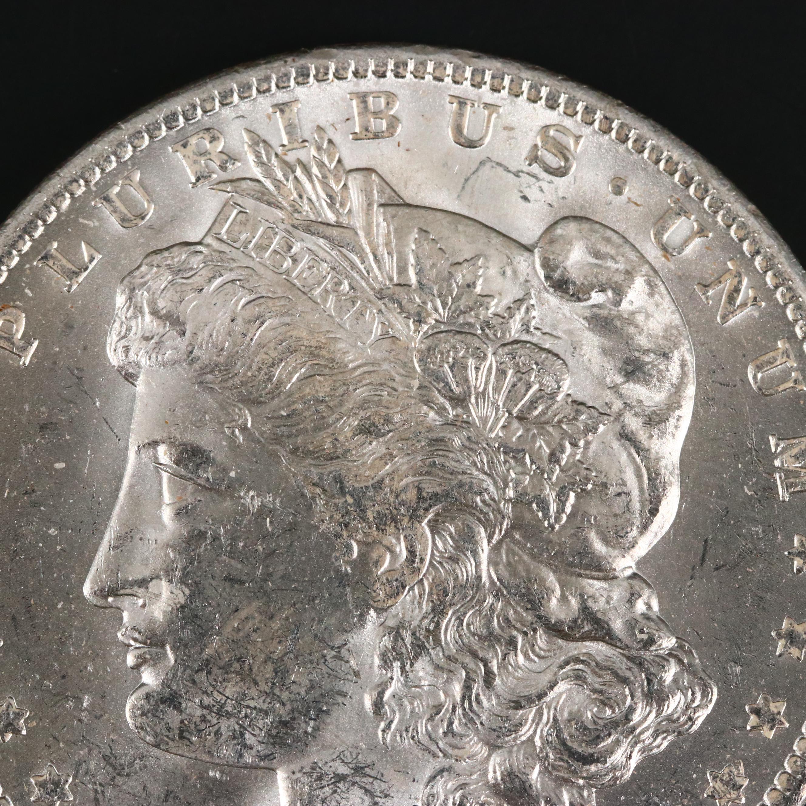 Eight Uncirculated Morgan Silver Dollars