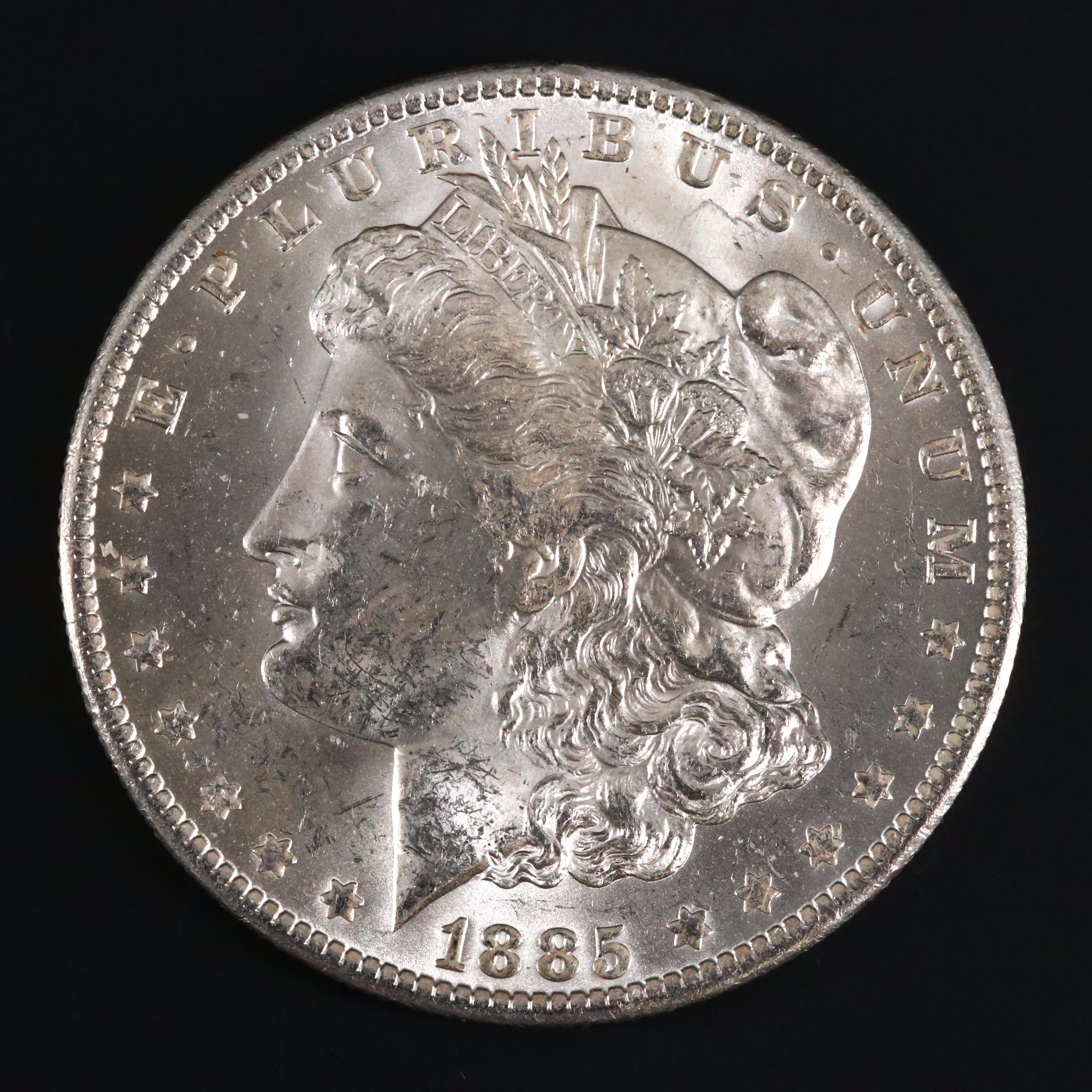 Eight Uncirculated Morgan Silver Dollars