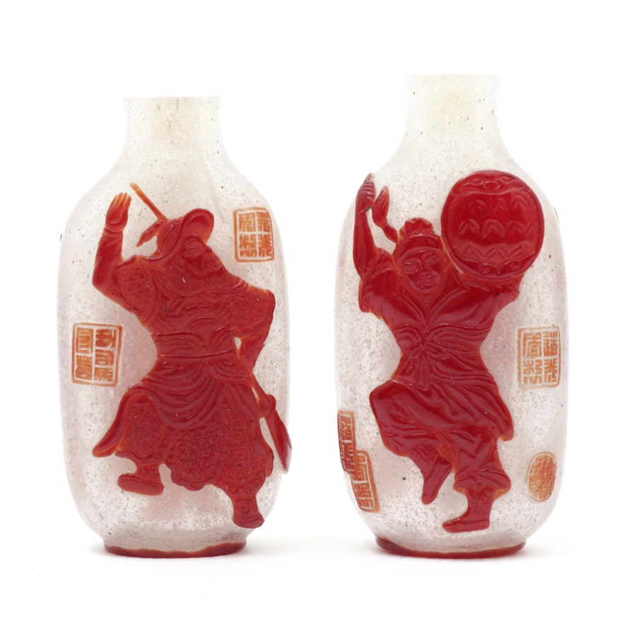 Pair of Chinese Red Overlay Bubble-Suffused Peking Glass Snuff Bottles