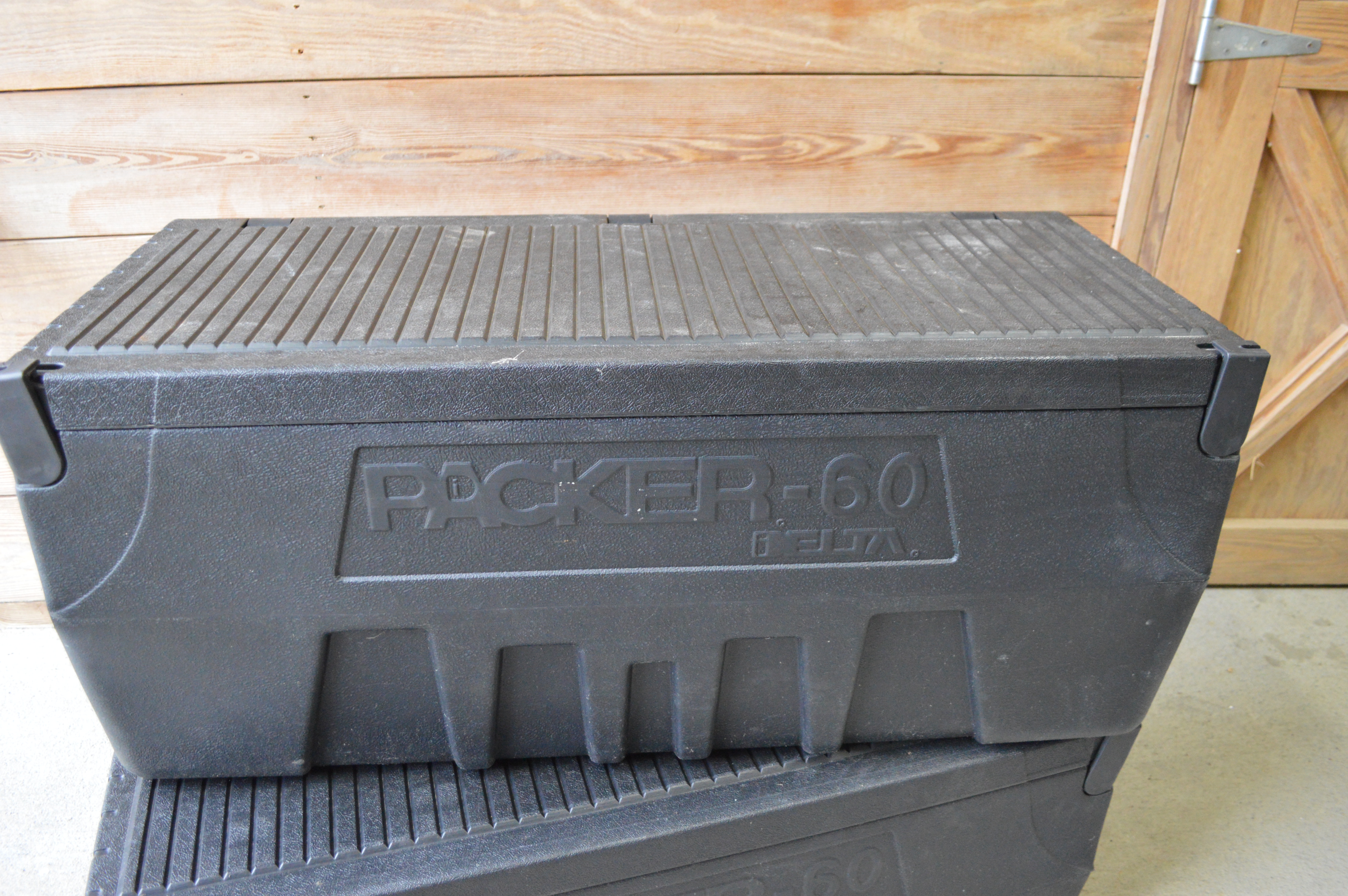 Pair of Delta Packer-60 Plastic Truck Tool Boxes