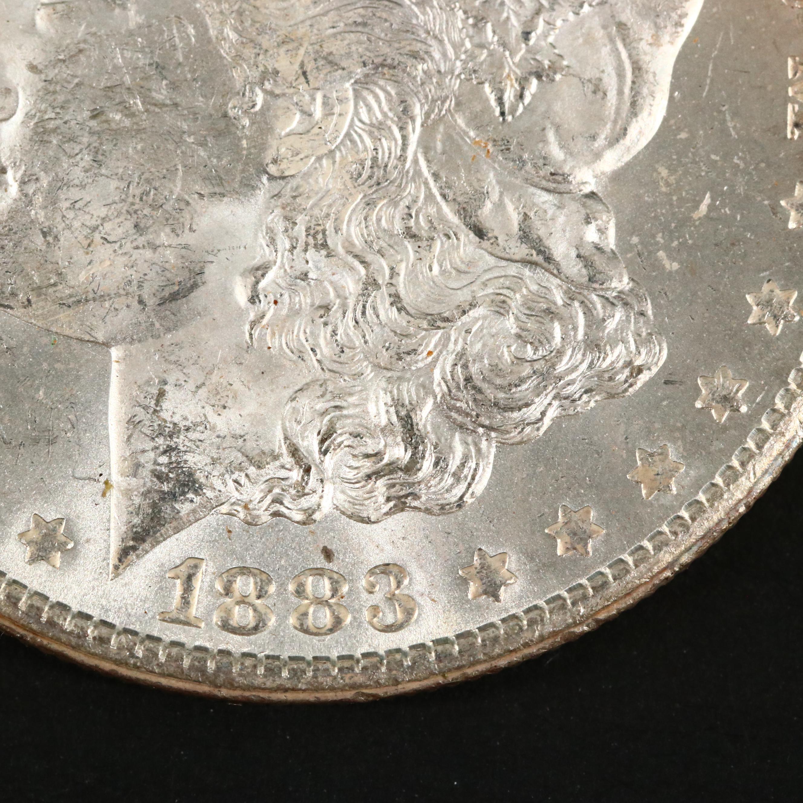 Three Uncirculated Carson City Morgan Silver Dollars