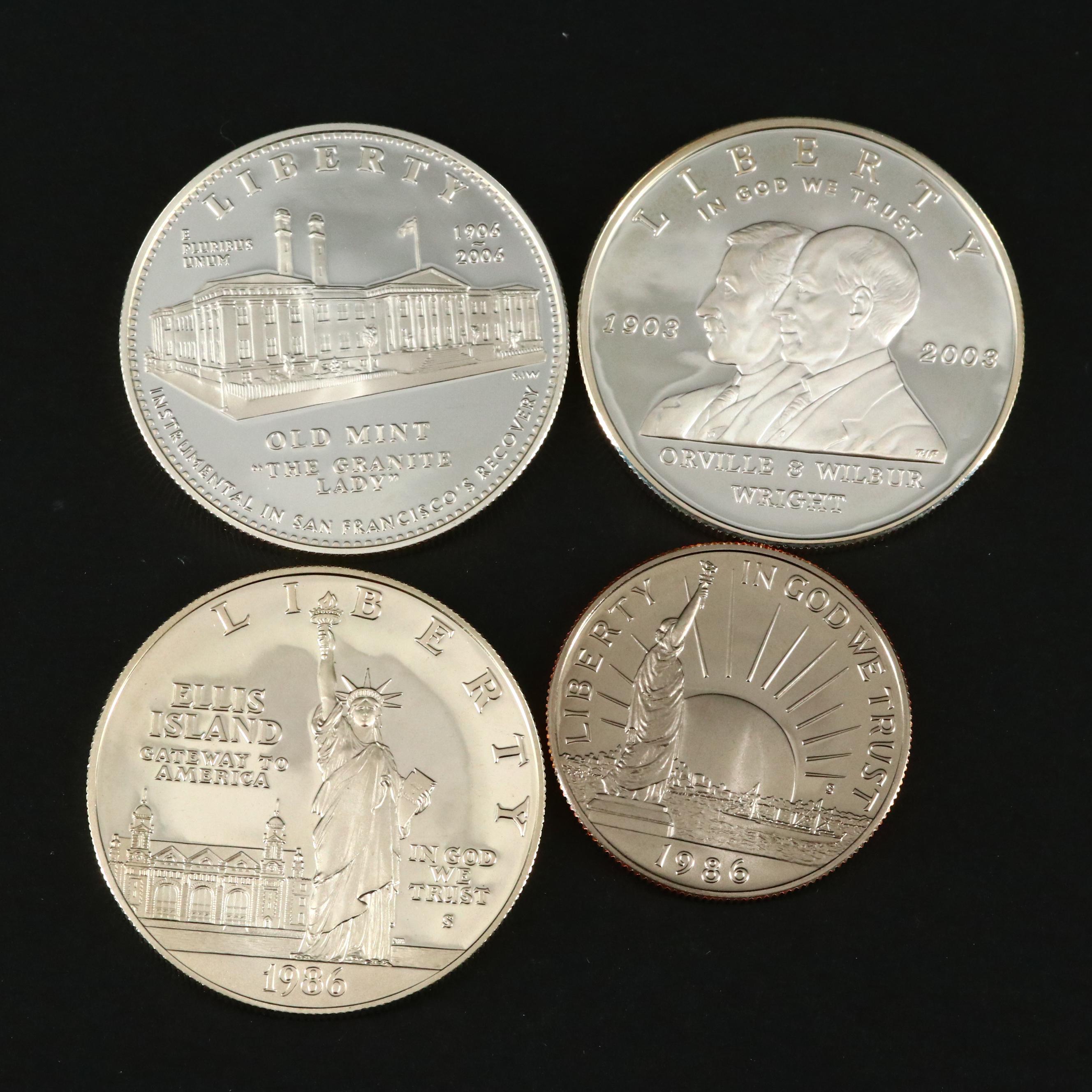 Three Modern Proof Commemorative Silver Dollars and a Proof Half Dollar