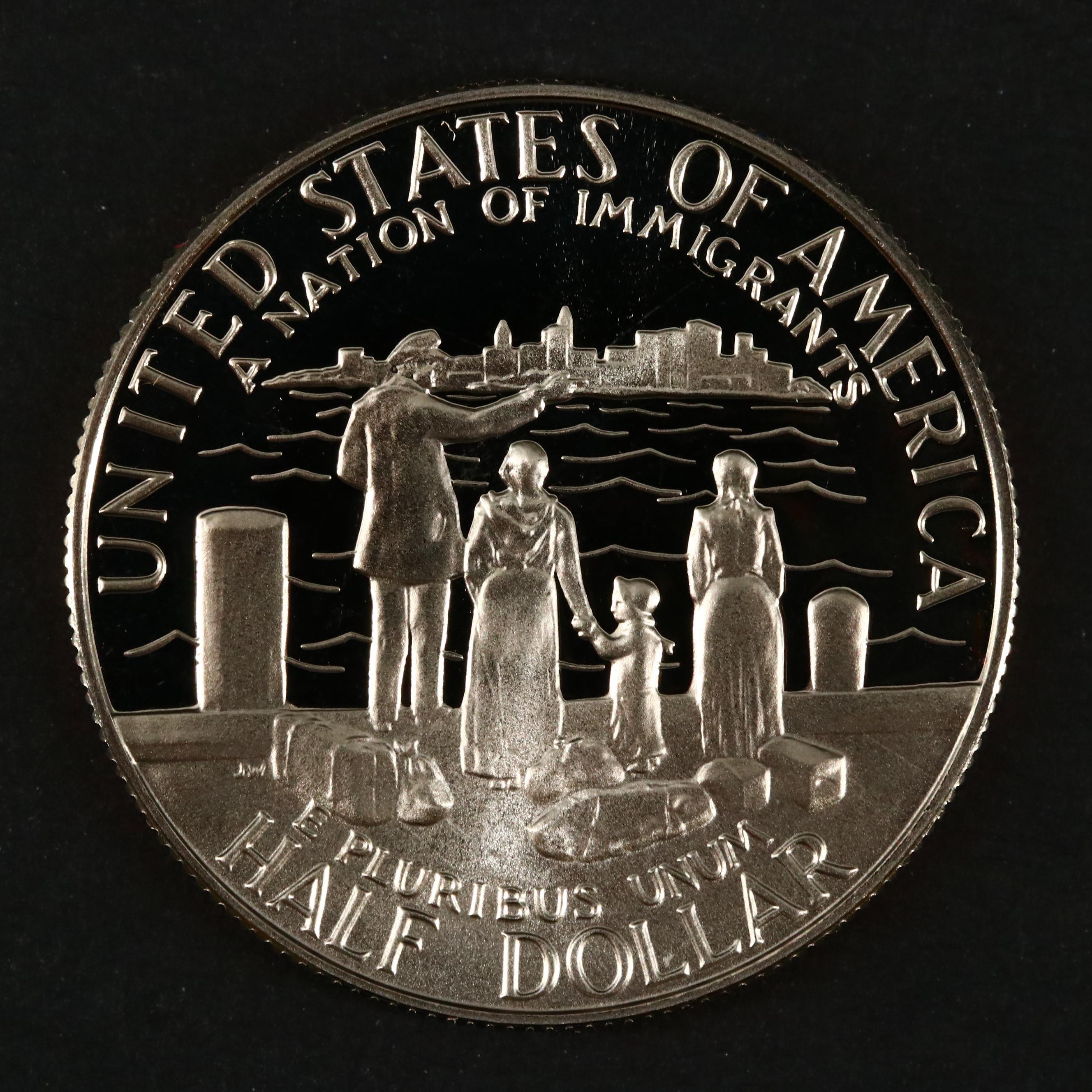 Three Modern Proof Commemorative Silver Dollars and a Proof Half Dollar