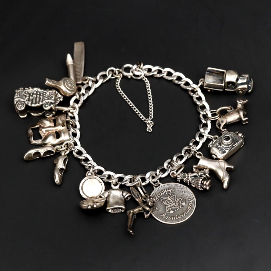 Charm Bracelet With Sterling Silver Charms Including Fairy and Circus Cart