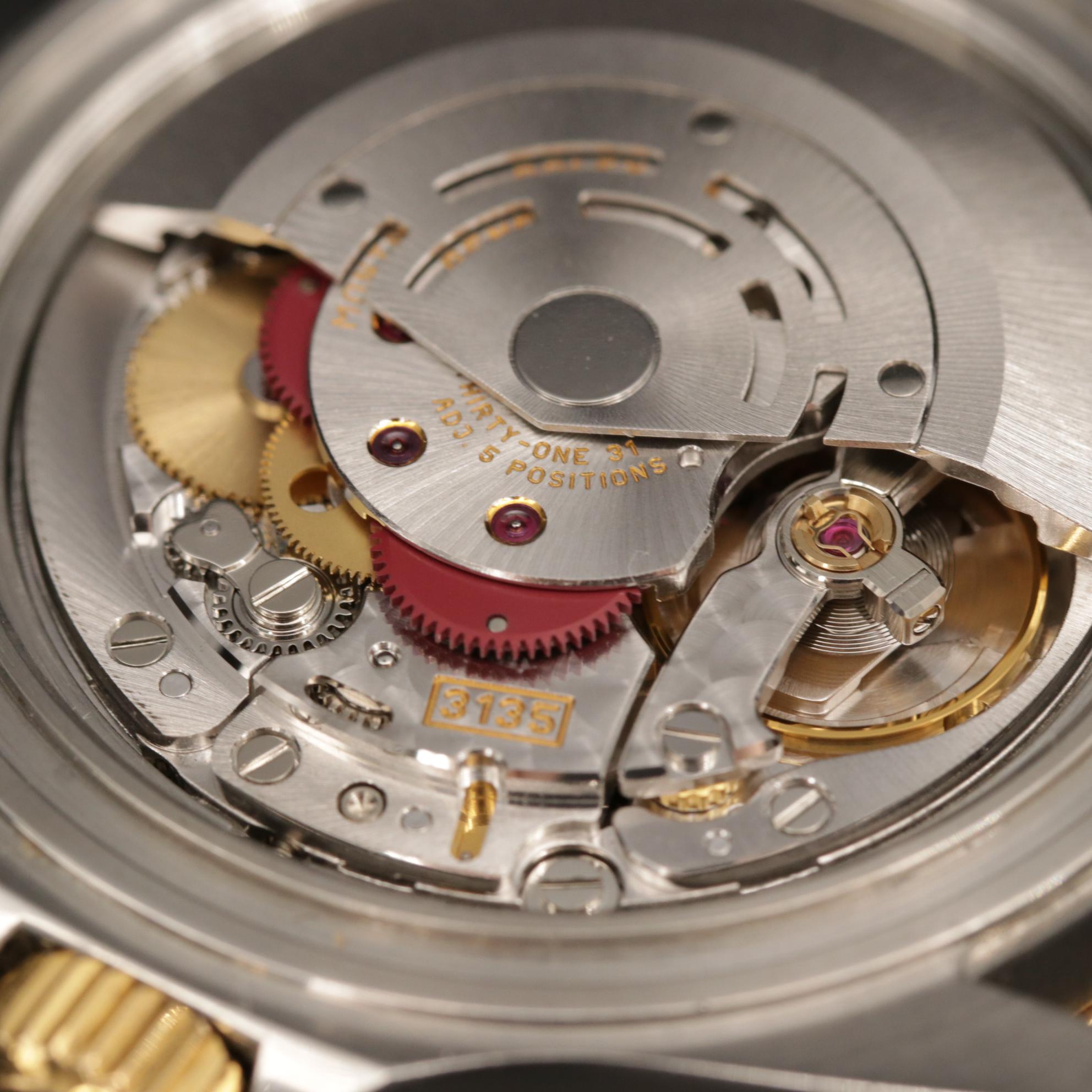 Rolex 18K Submariner Sapphire and Diamond Watch with Serti Dial, 1999