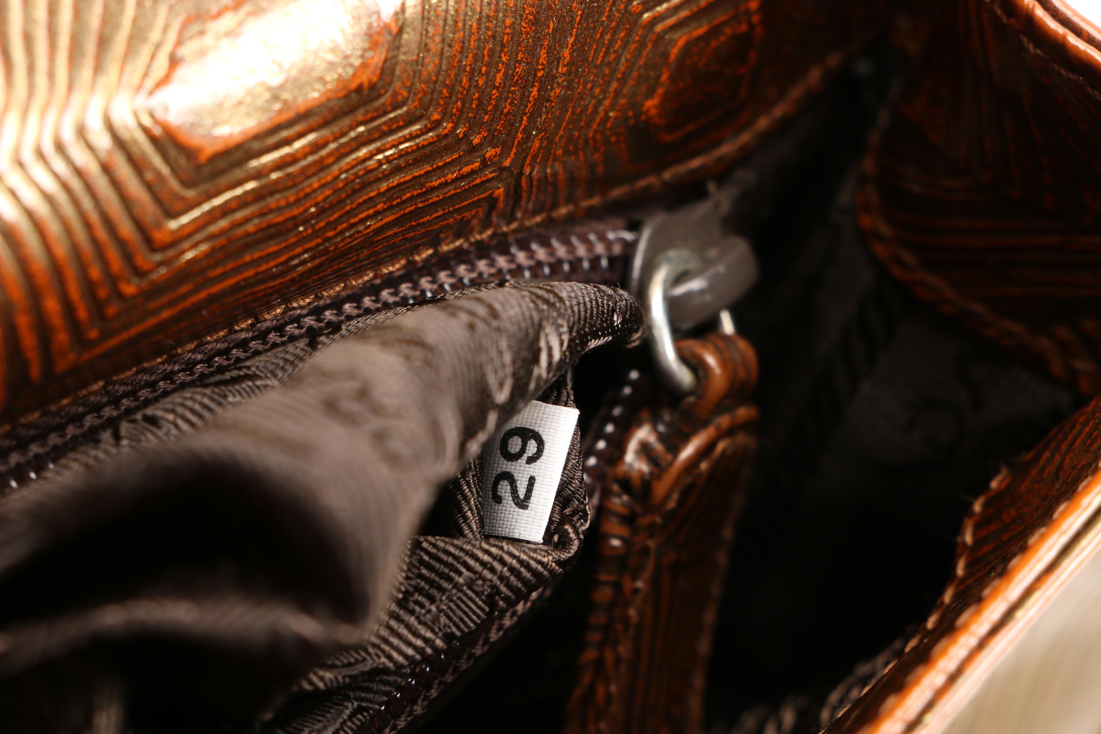 Prada Baguette in Brown Embossed Leather