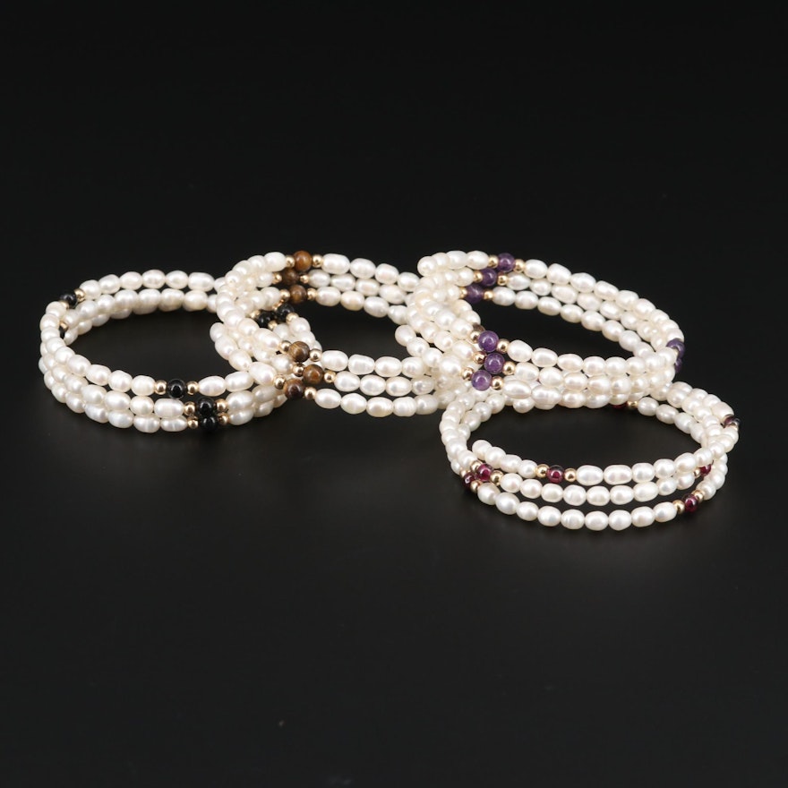 Cultured Pearl, Garnet, Amethyst, and Tiger's Eye Wrap Bracelets.