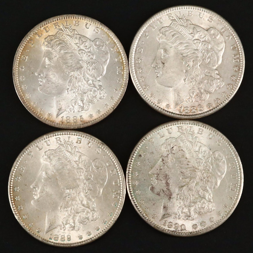 Four Silver Morgan Dollars Including an 1885-O and 1890