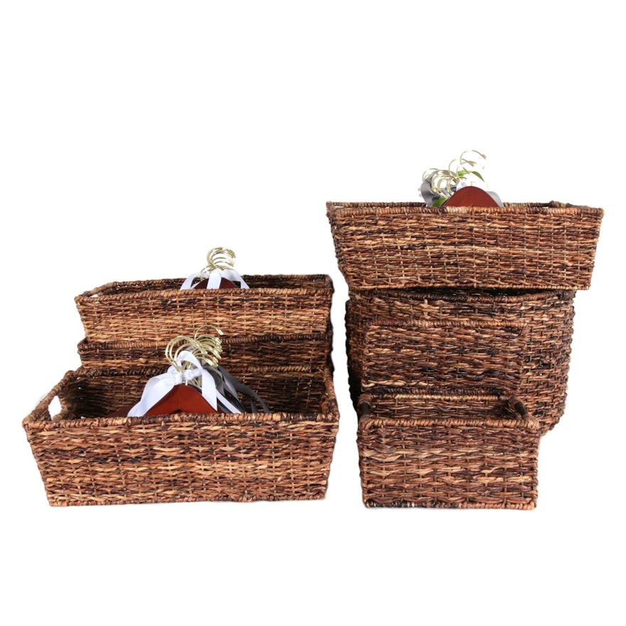 Woven Rattan Storage Baskets with Cherry-Stained Wooden Clothes Hangers