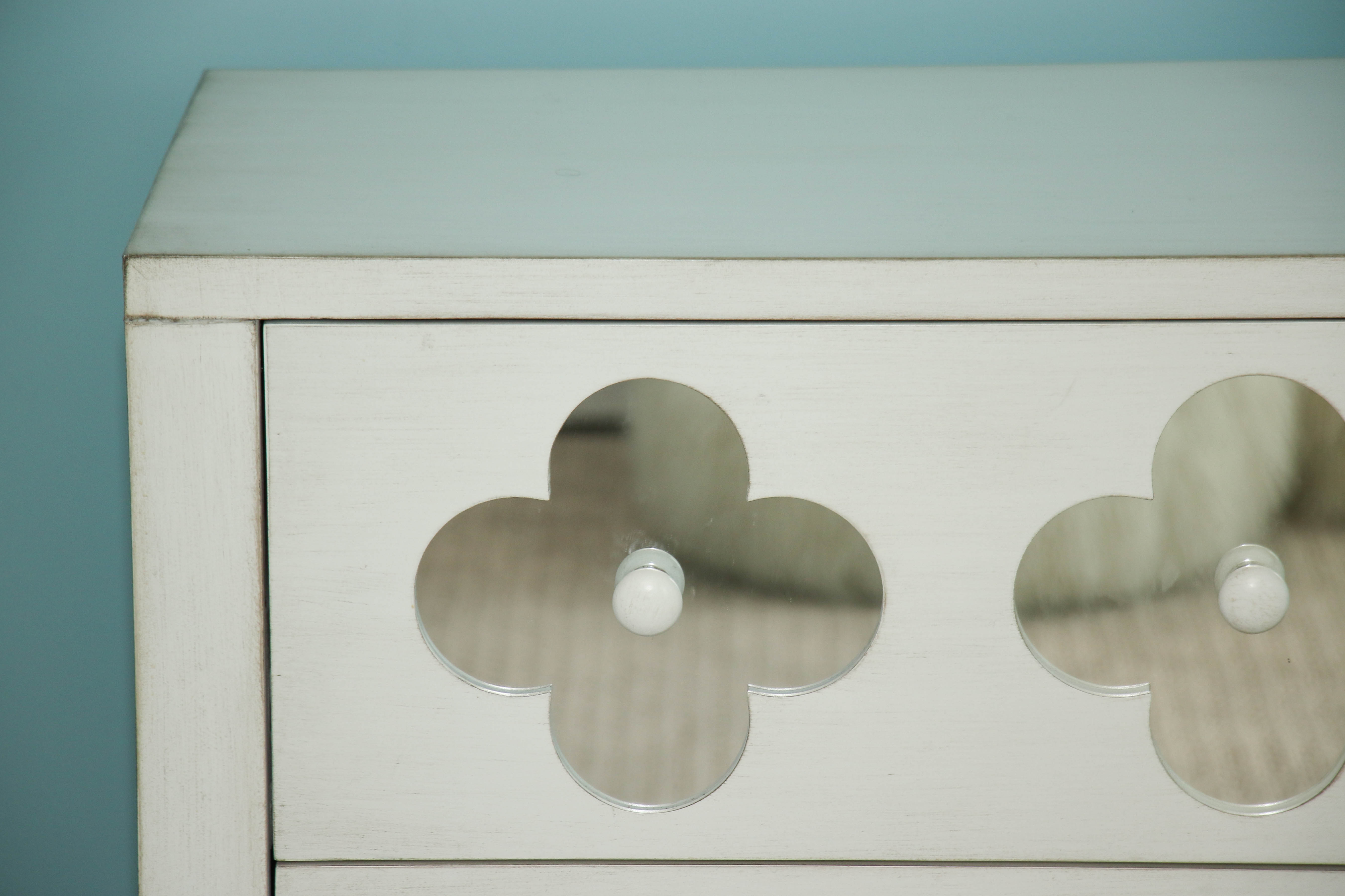 White Wooden Dresser with Mirrored Floral Fronts