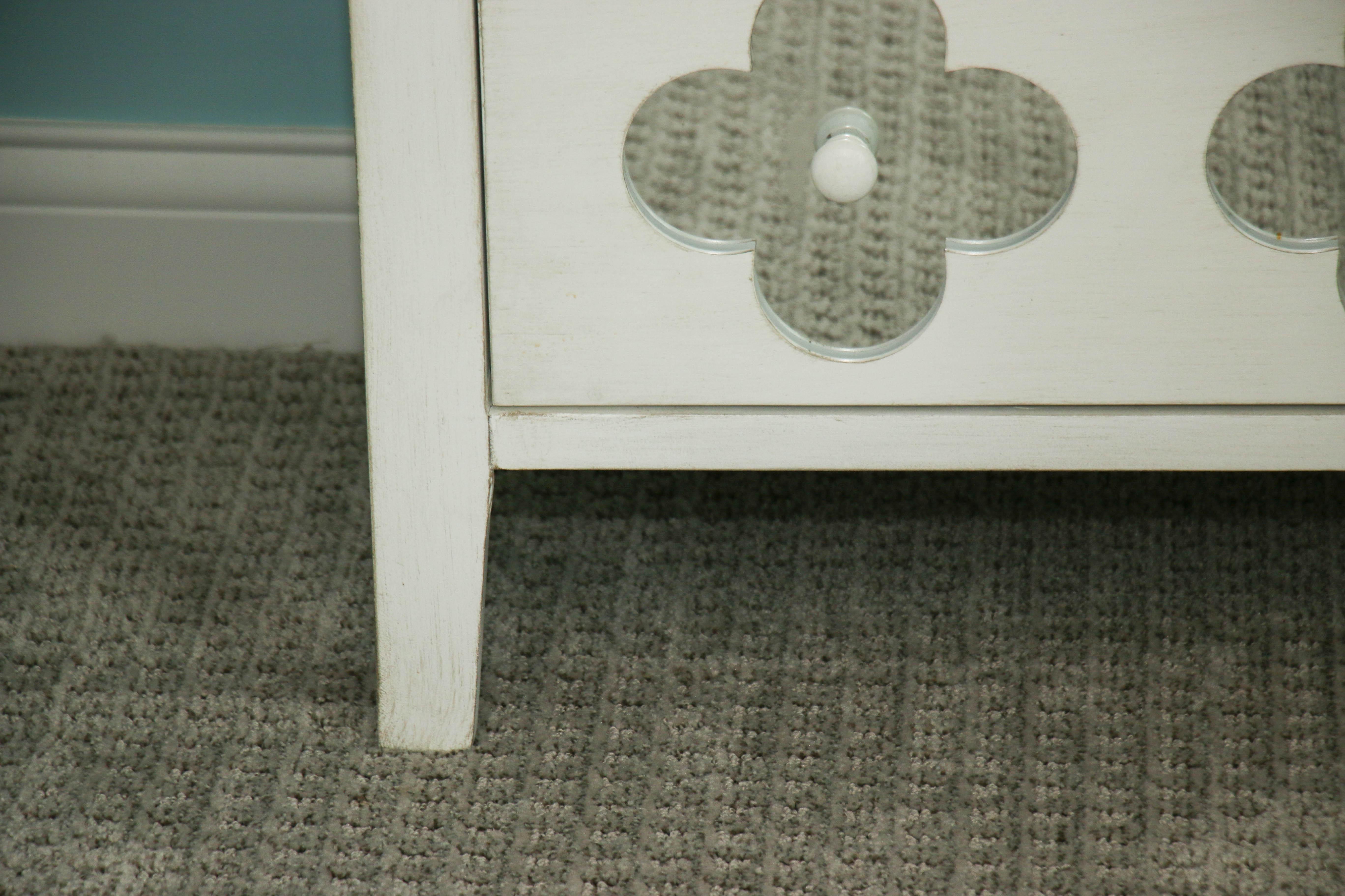 White Wooden Dresser with Mirrored Floral Fronts
