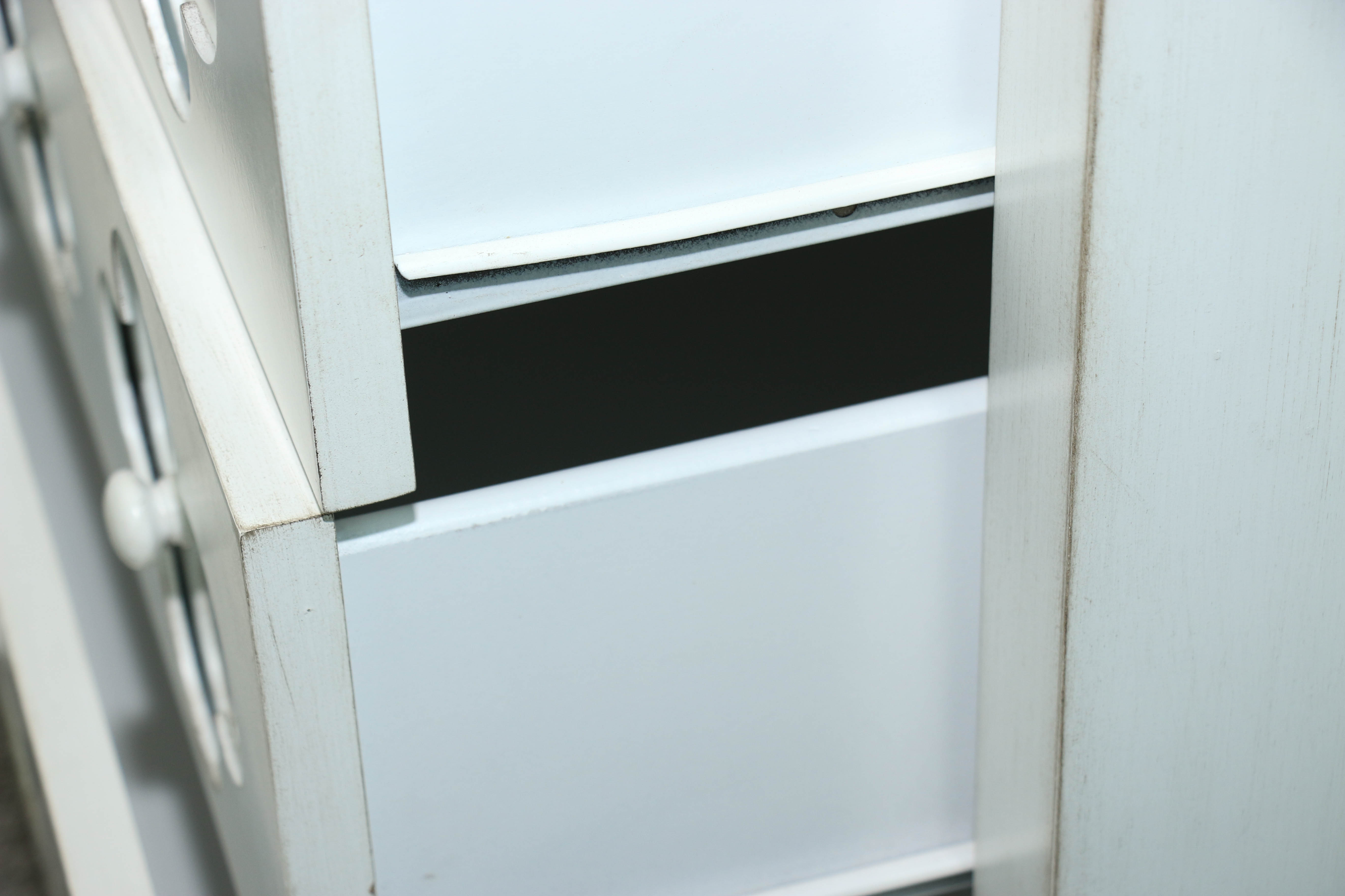 White Wooden Dresser with Mirrored Floral Fronts