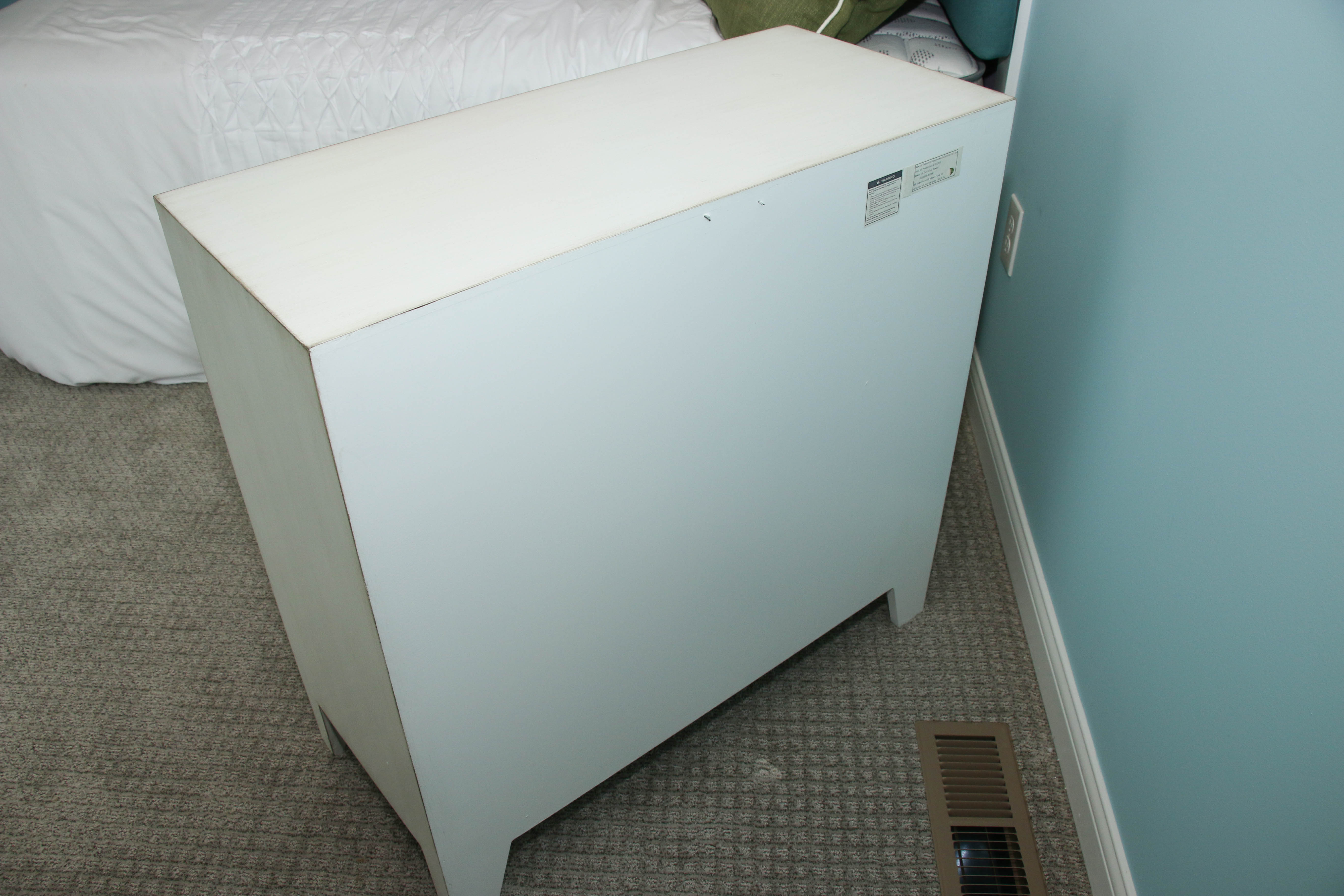 White Wooden Dresser with Mirrored Floral Fronts