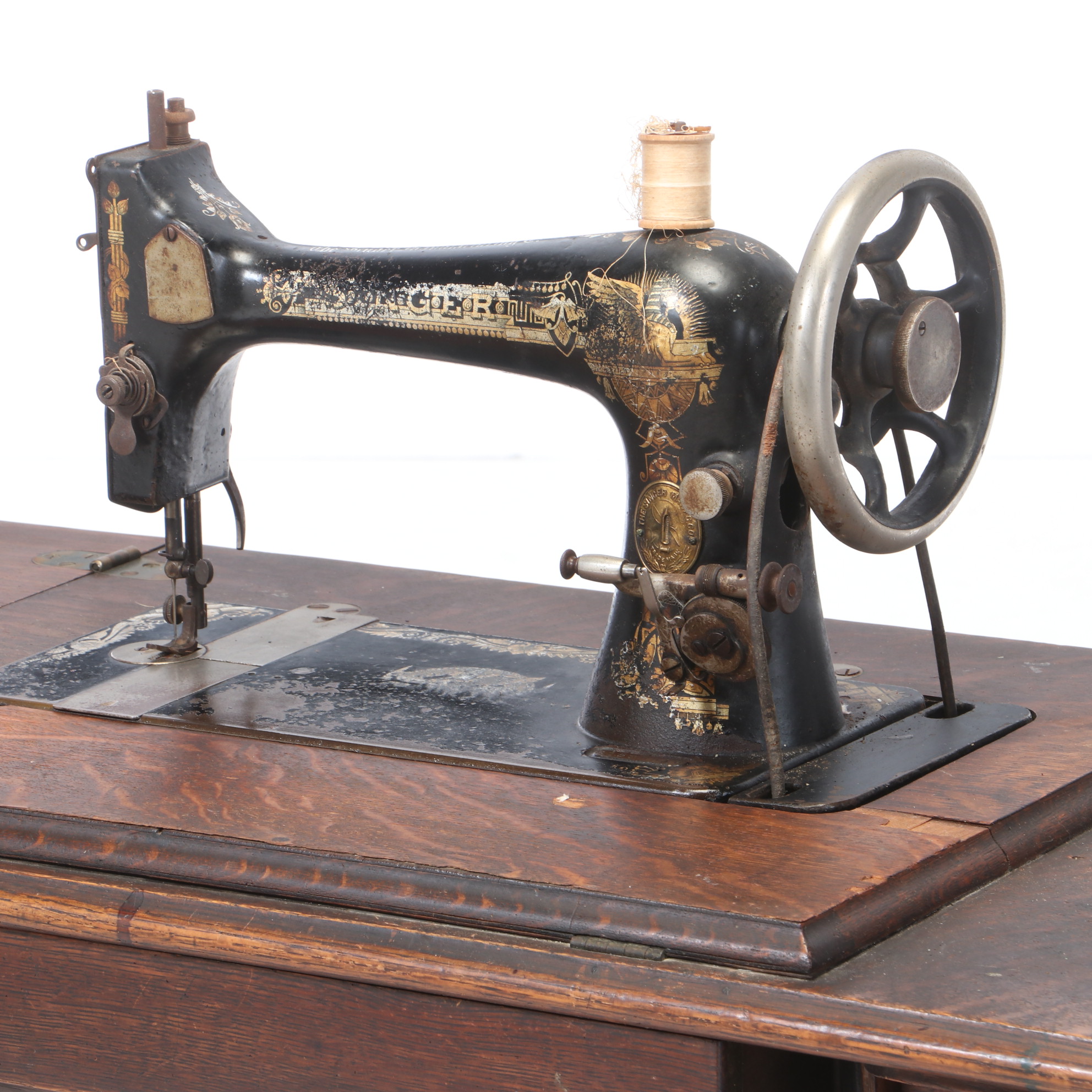 Oak and Cast Iron Singer Sewing Machine and Table, circa 1900