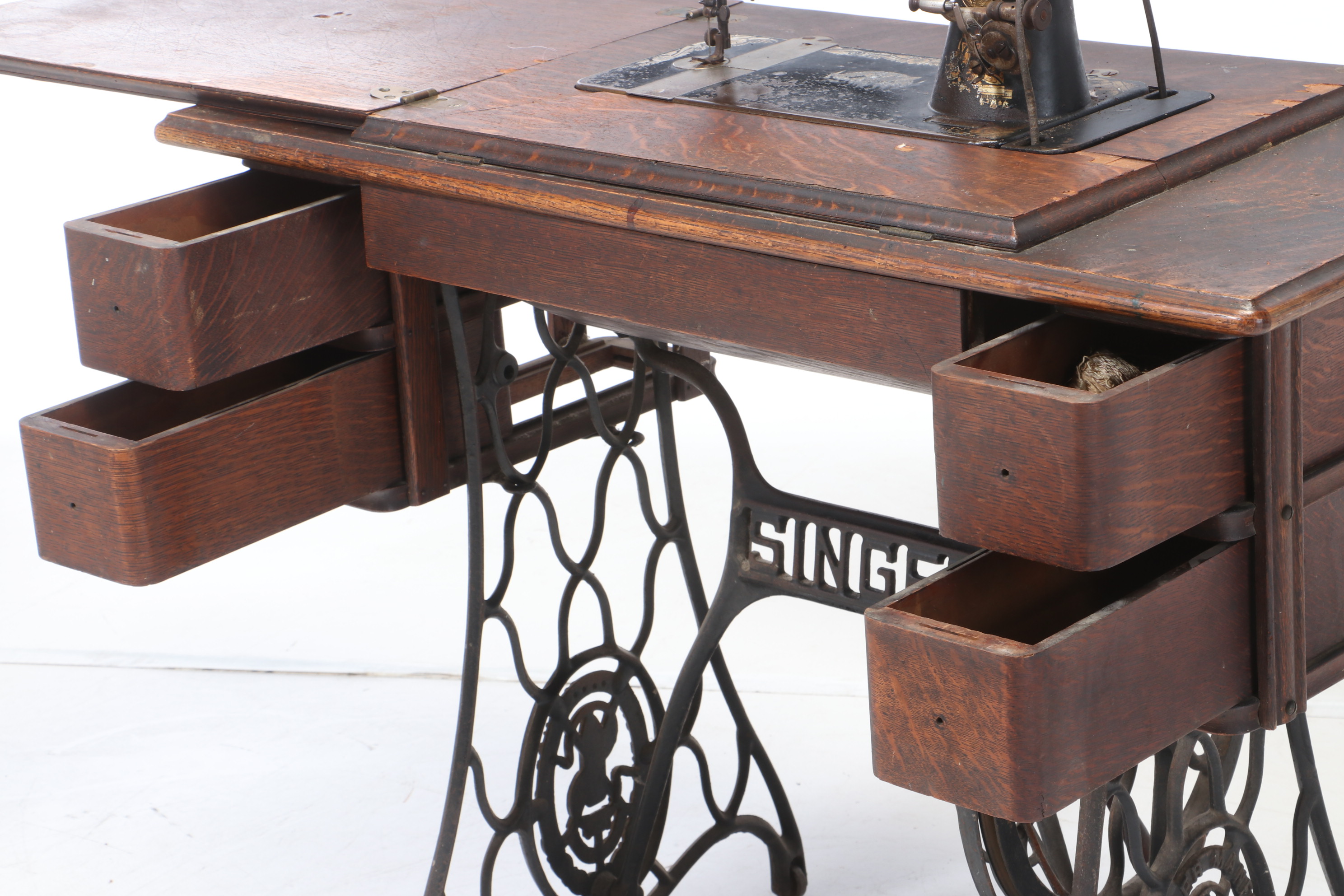 Oak and Cast Iron Singer Sewing Machine and Table, circa 1900