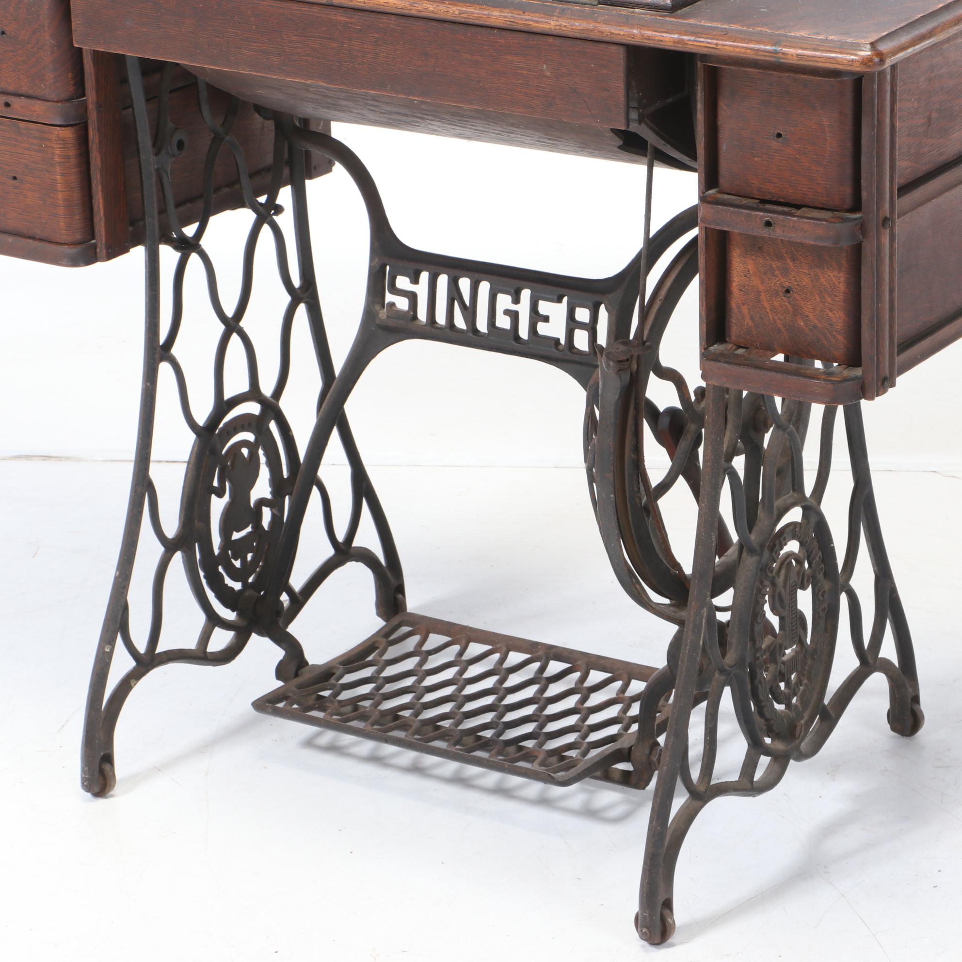 Oak and Cast Iron Singer Sewing Machine and Table, circa 1900