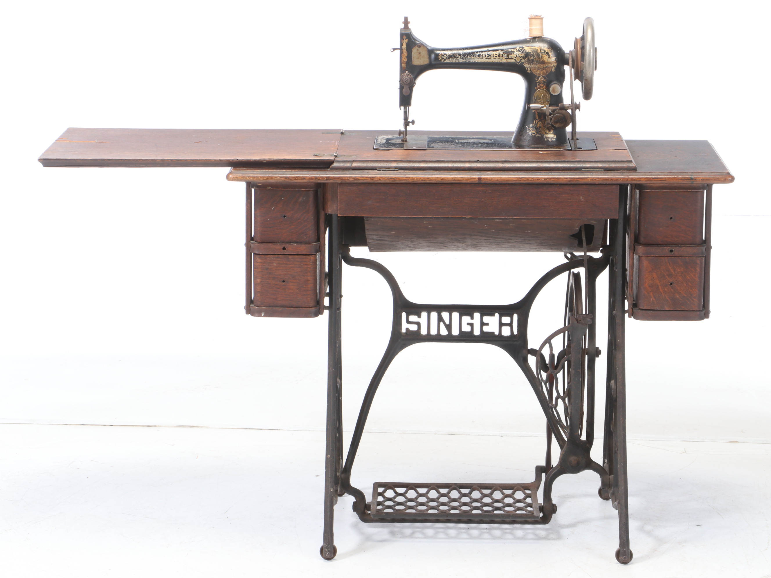 Oak and Cast Iron Singer Sewing Machine and Table, circa 1900