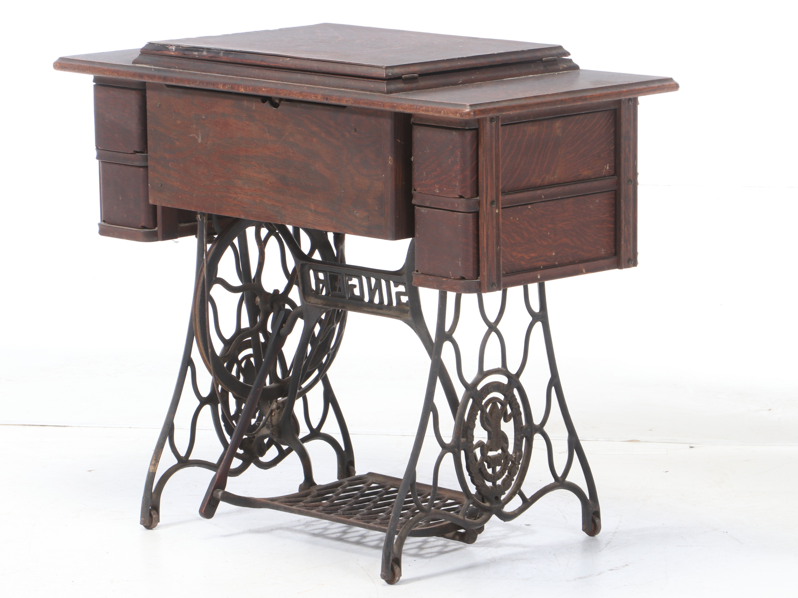 Oak and Cast Iron Singer Sewing Machine and Table, circa 1900