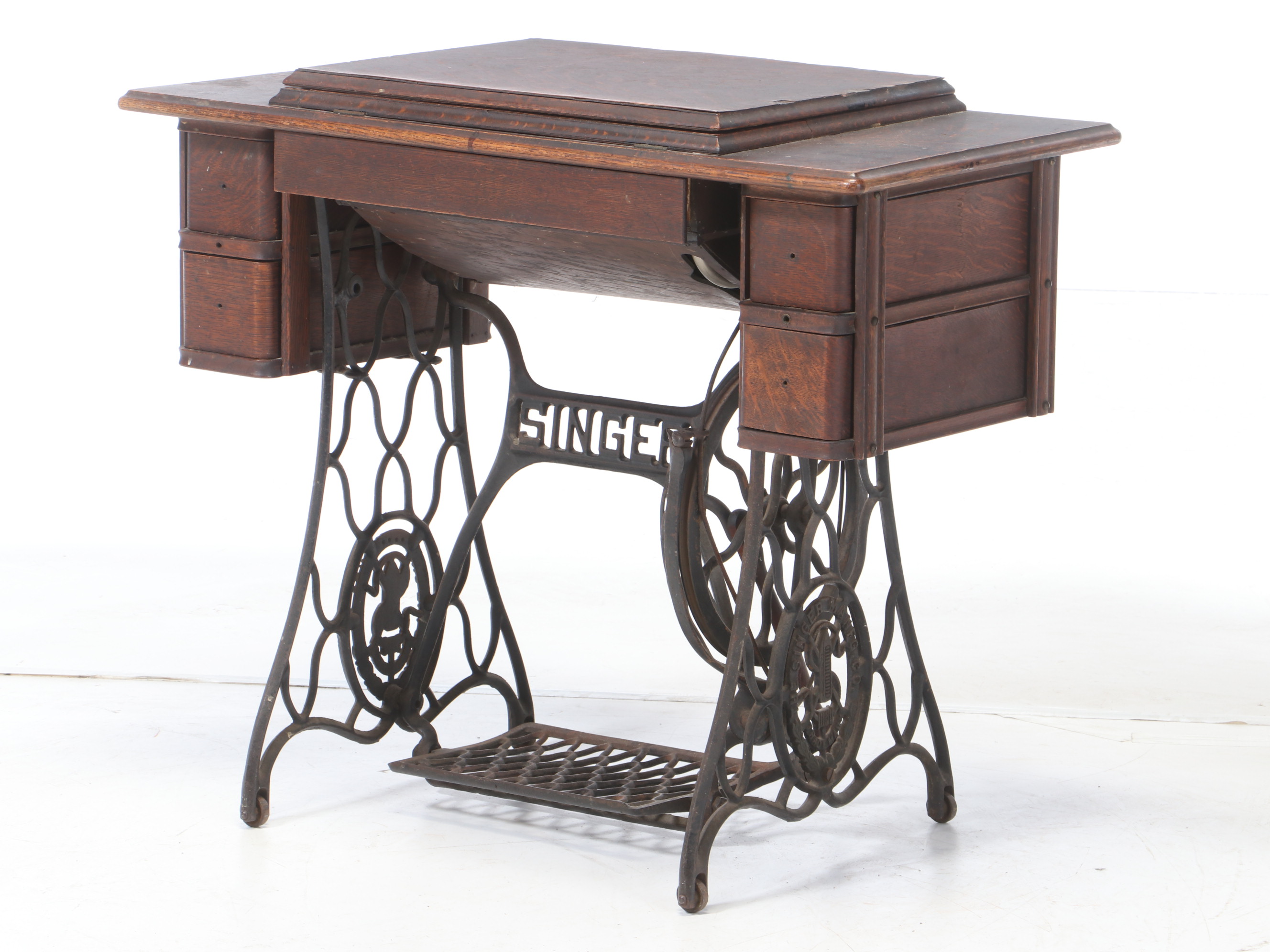 Oak and Cast Iron Singer Sewing Machine and Table, circa 1900