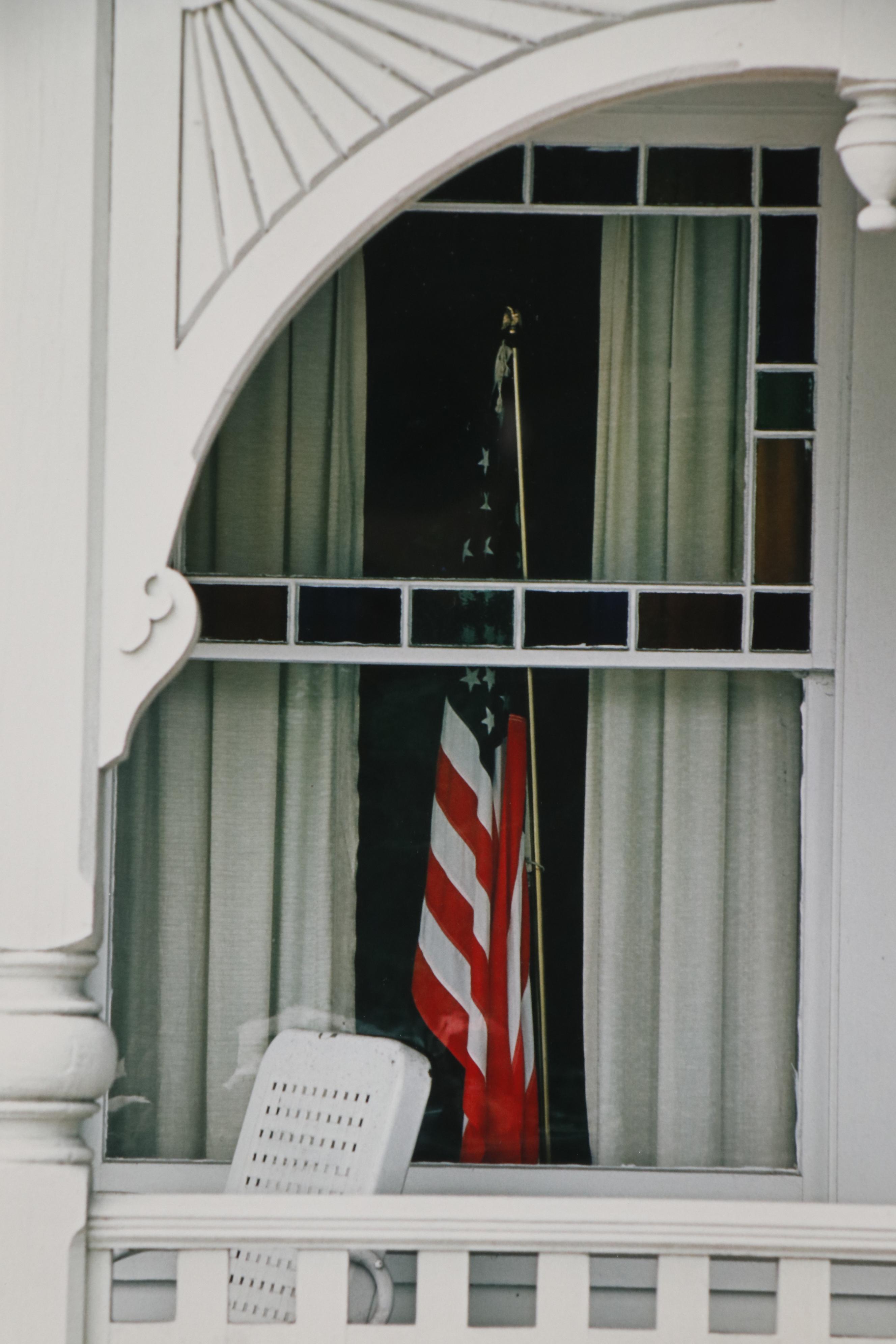 Color Photograph of Americn Flag in Window