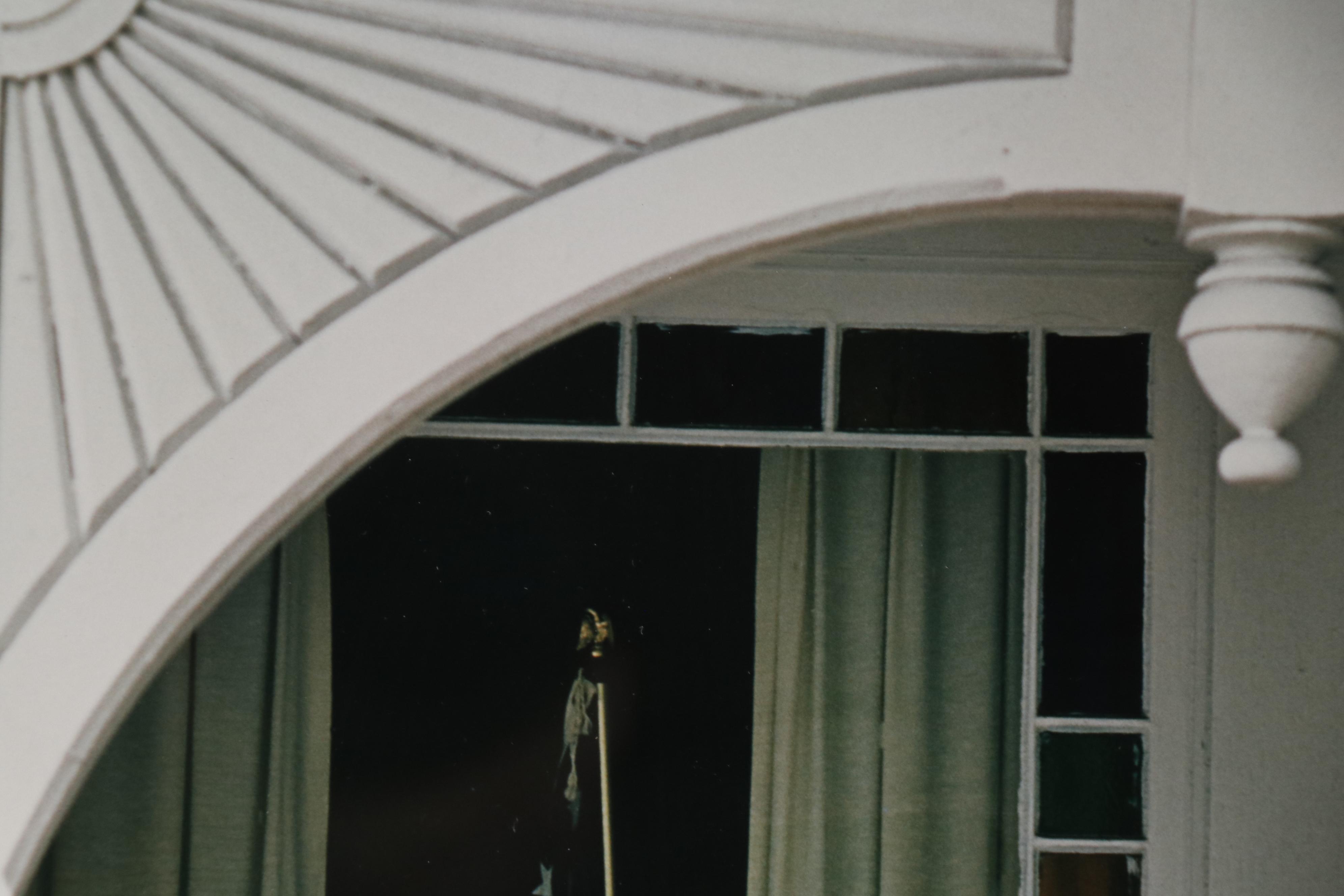 Color Photograph of Americn Flag in Window