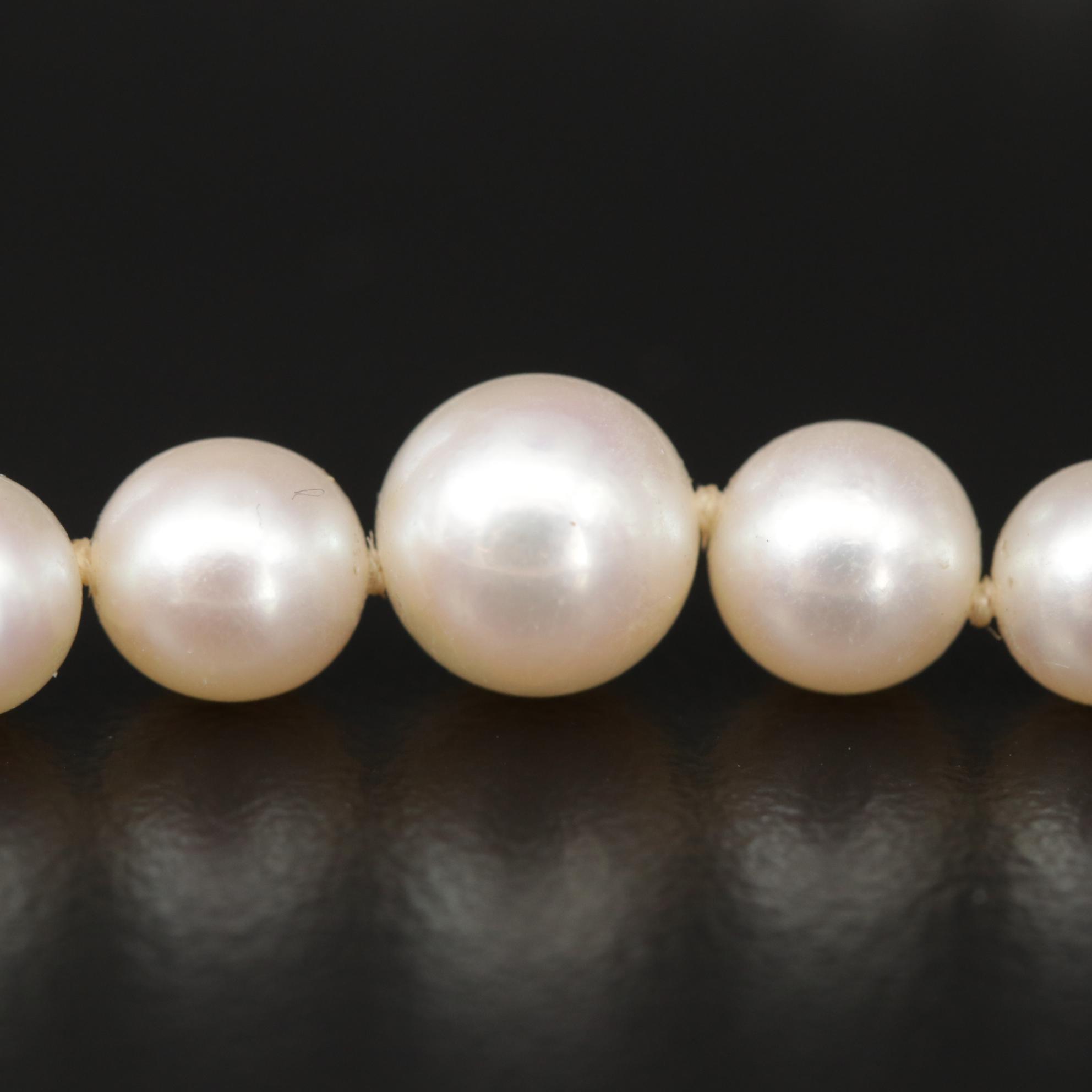 Graduated Strand of Mikimoto Pearls with Sterling Silver Clasp