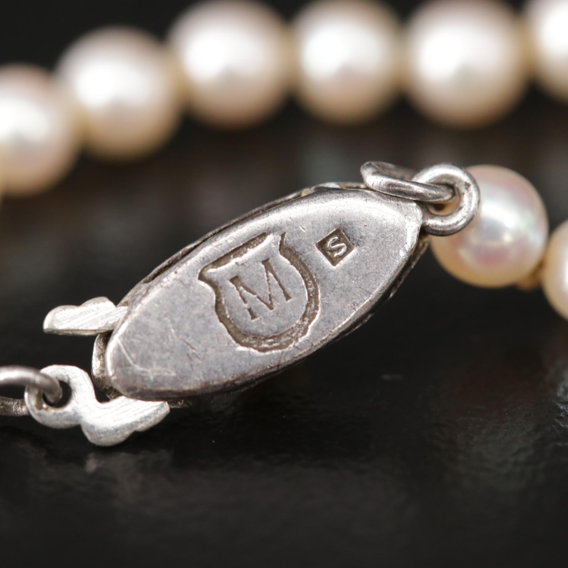 Graduated Strand of Mikimoto Pearls with Sterling Silver Clasp