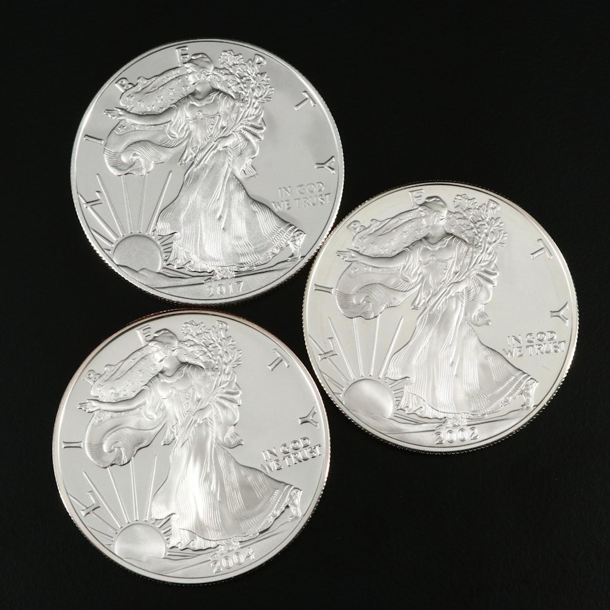 Three $1 U.S. Silver Eagle Proof Coins Including 2002-W,  2004-W, and 2017-W