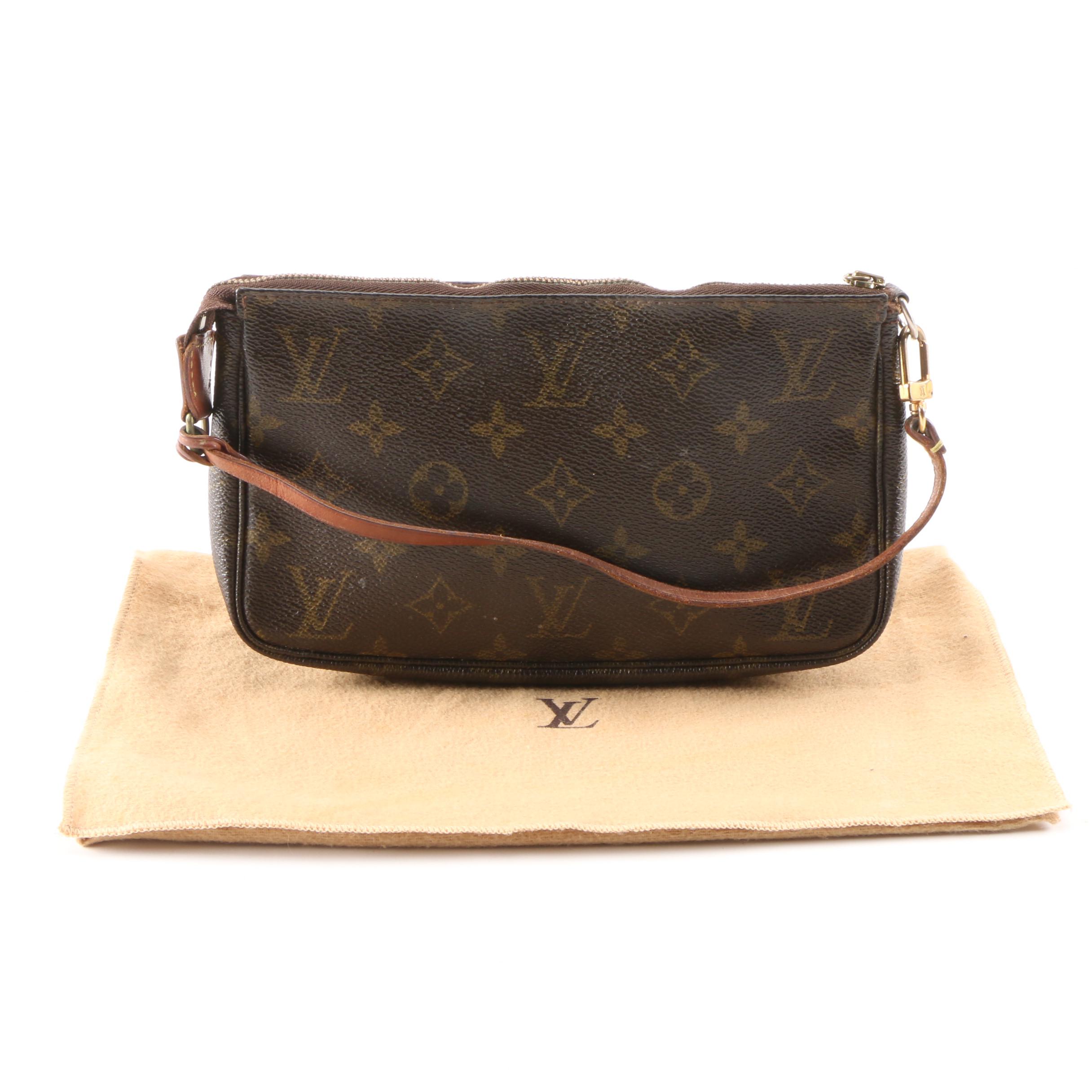 Louis Vuitton Wristlet in Coated Canvas and Leather