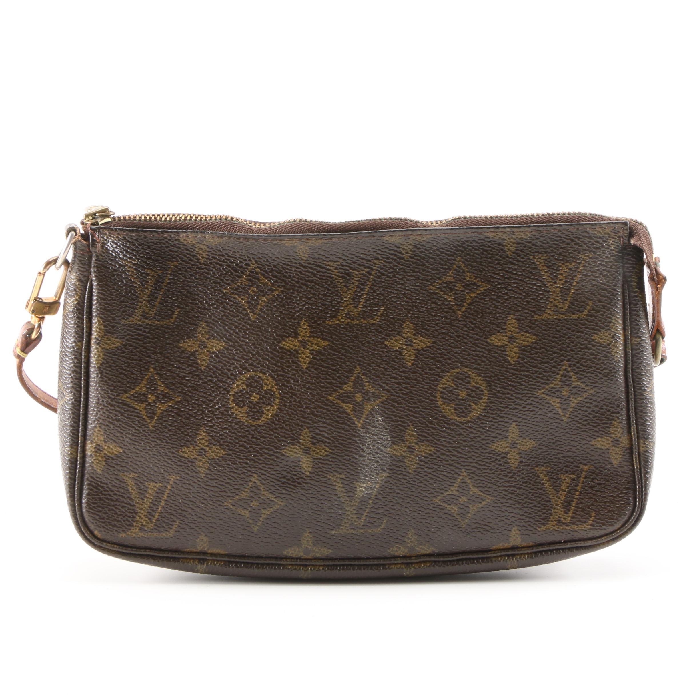 Louis Vuitton Wristlet in Coated Canvas and Leather