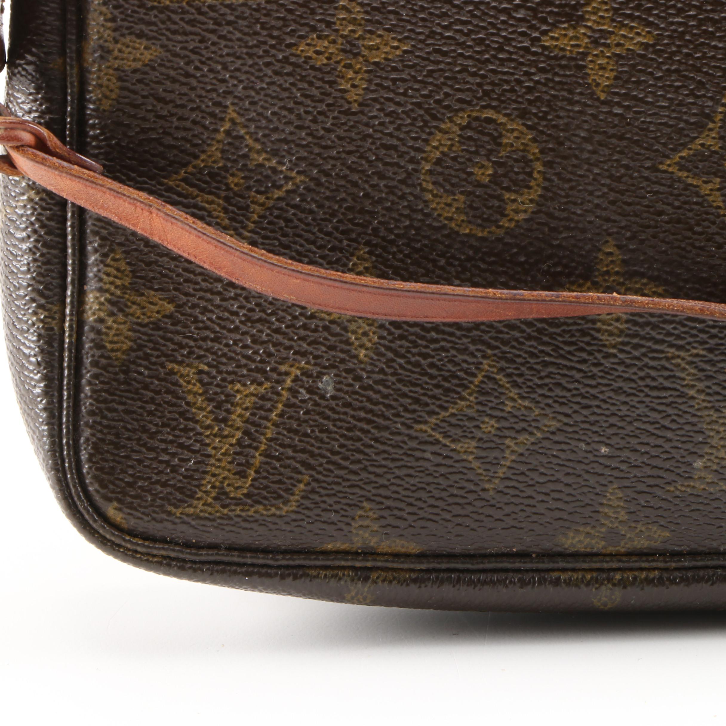Louis Vuitton Wristlet in Coated Canvas and Leather