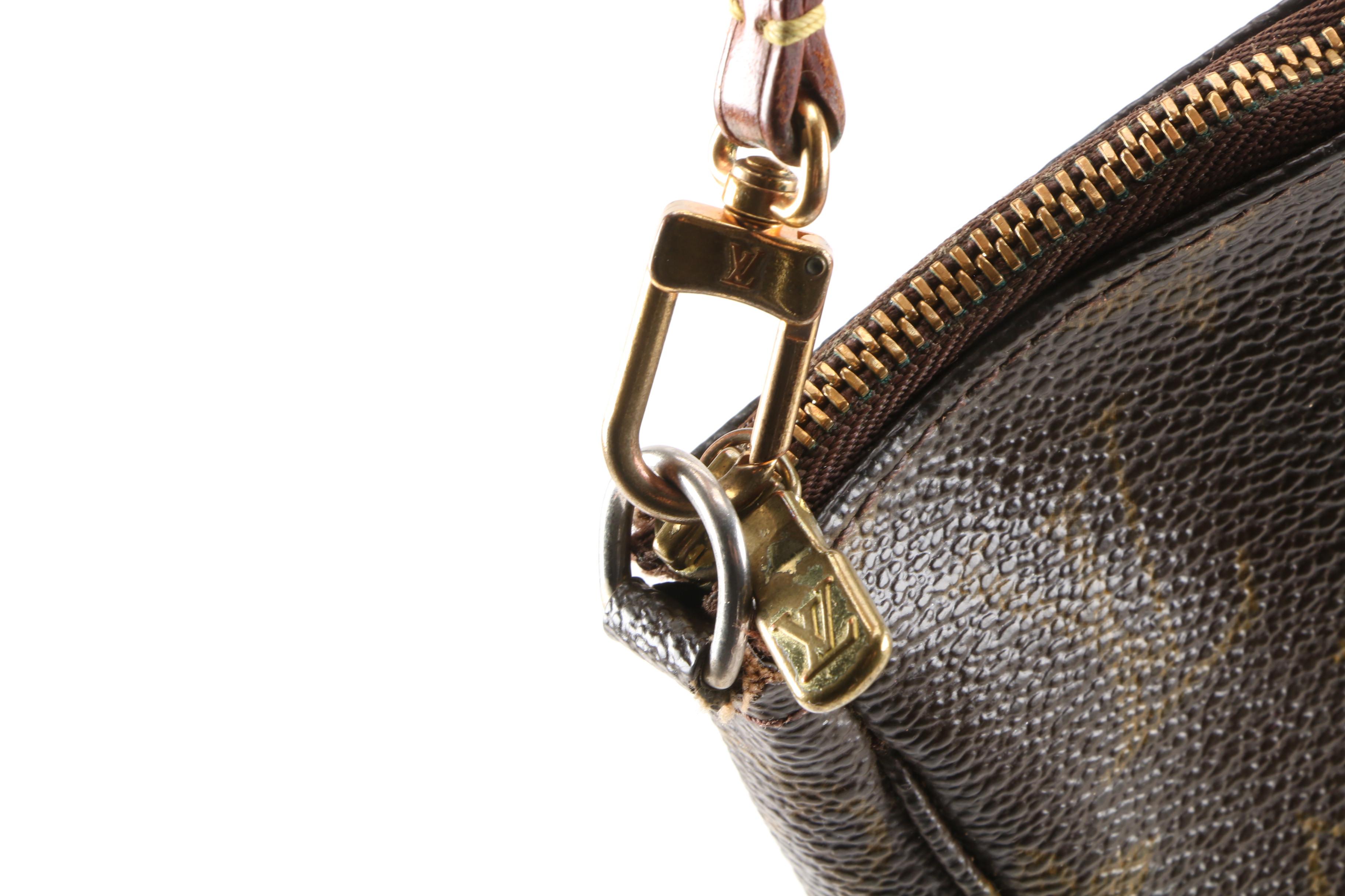 Louis Vuitton Wristlet in Coated Canvas and Leather