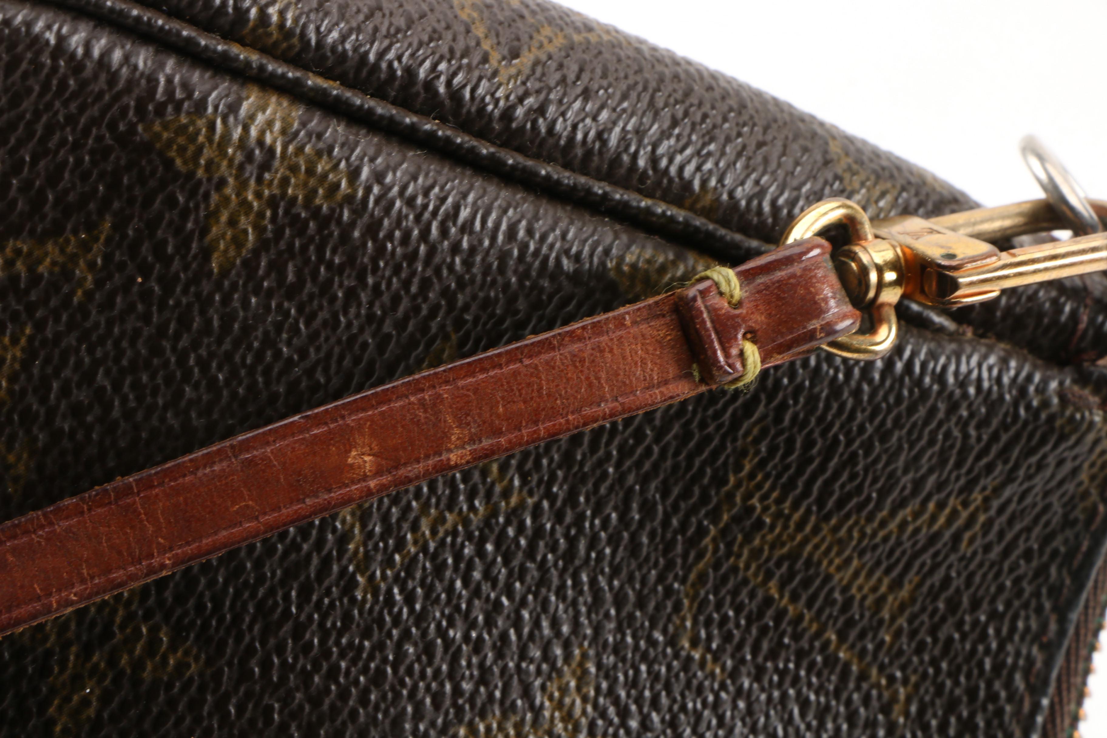 Louis Vuitton Wristlet in Coated Canvas and Leather