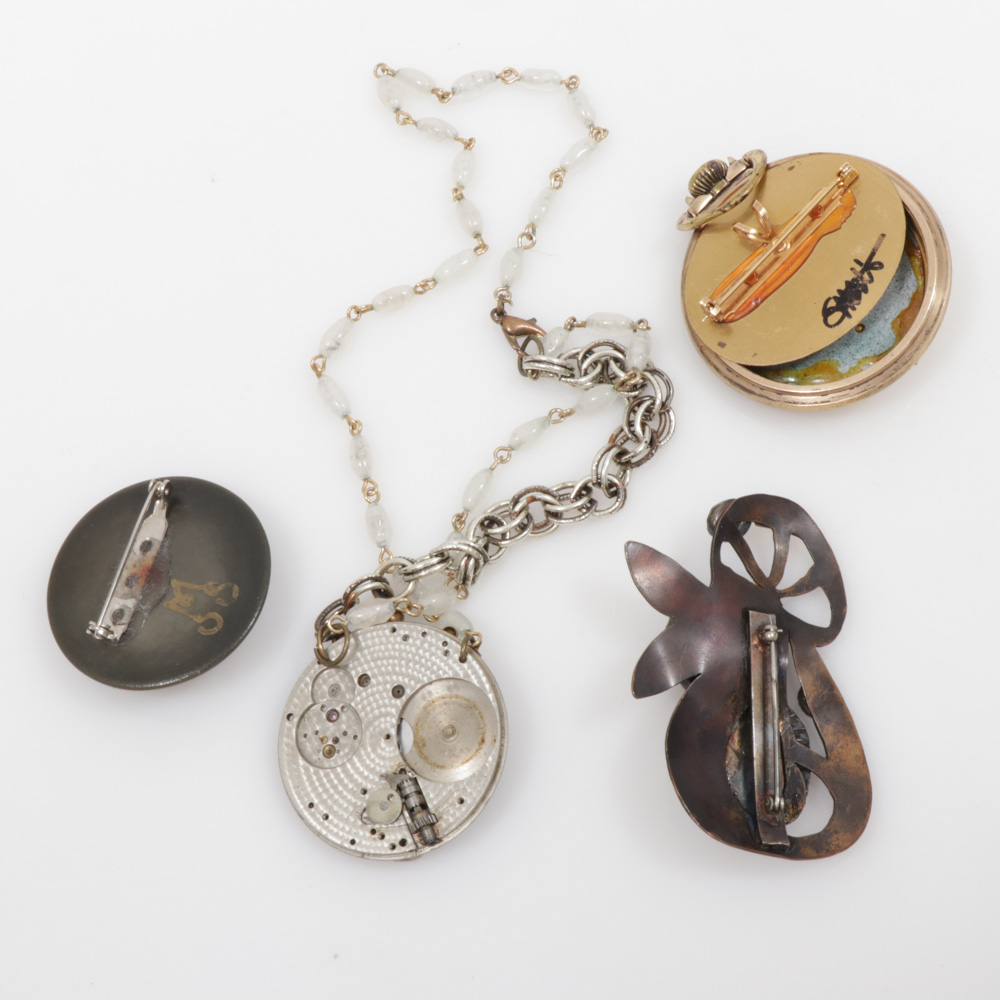 Assembled Brooches and Necklace Featuring Steampunk Motif Piece