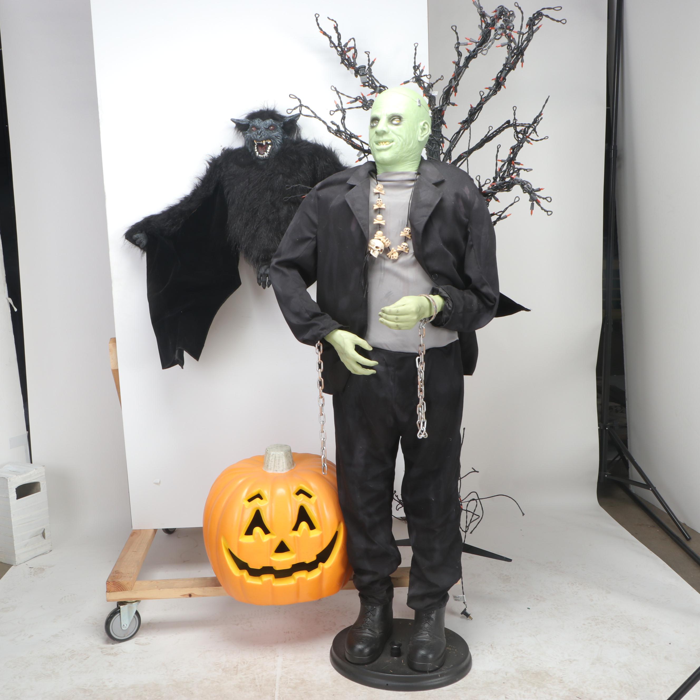 Halloween Décor Including Life-Size Zombie, Large Bat, and Illuminated Tree